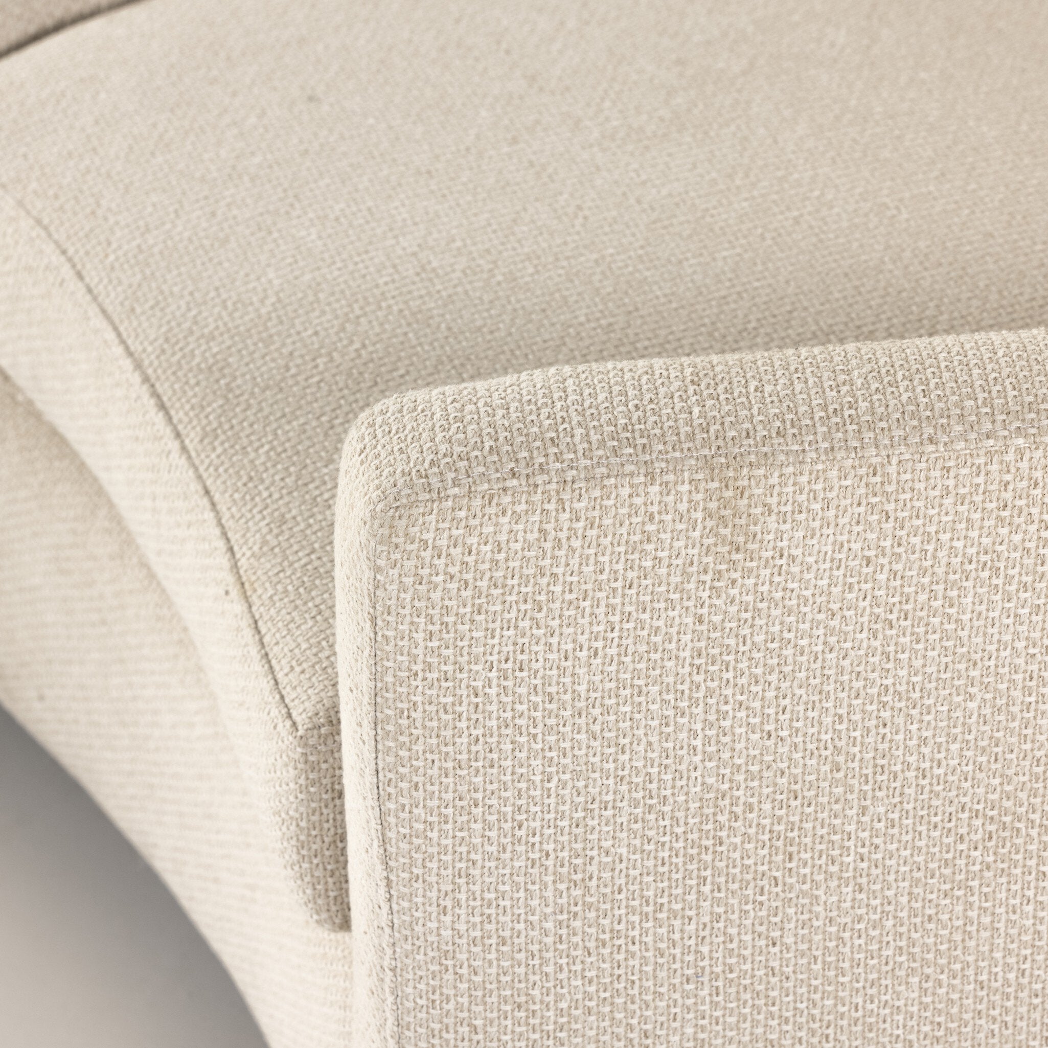 Close-up of beige fabric texture on a sofa