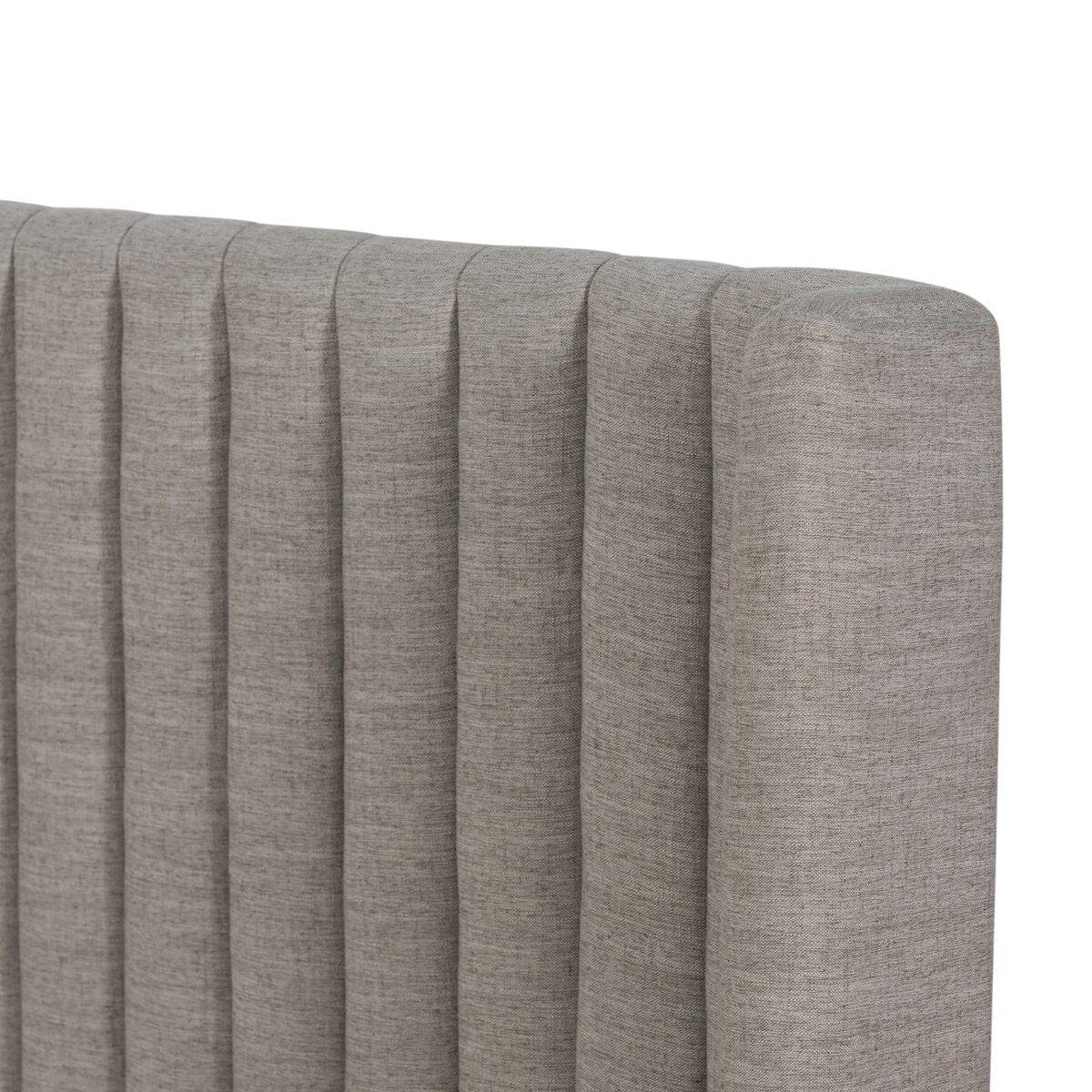 Gray upholstered headboard with a textured finish