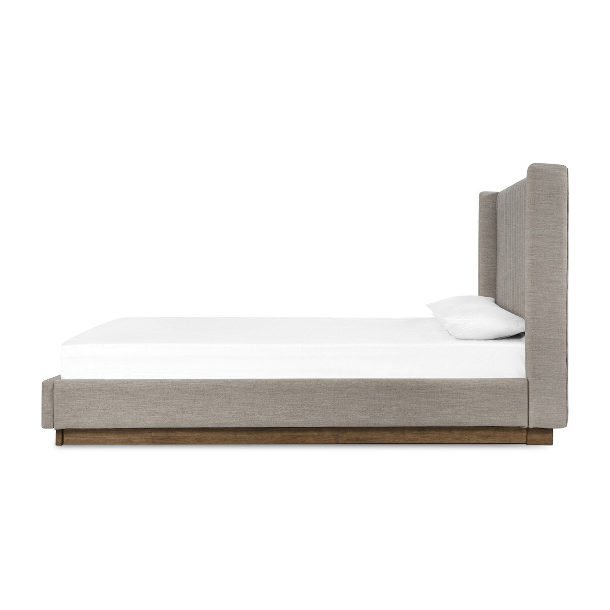 Bed with wooden frame and white mattress