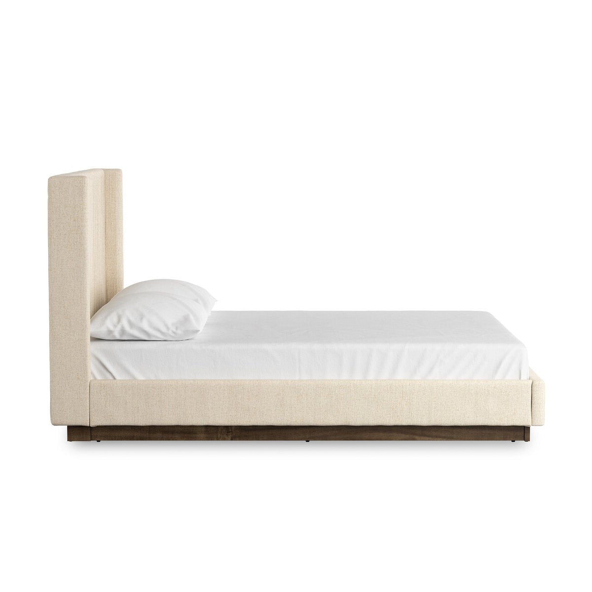 Beige bed with white mattress and pillow