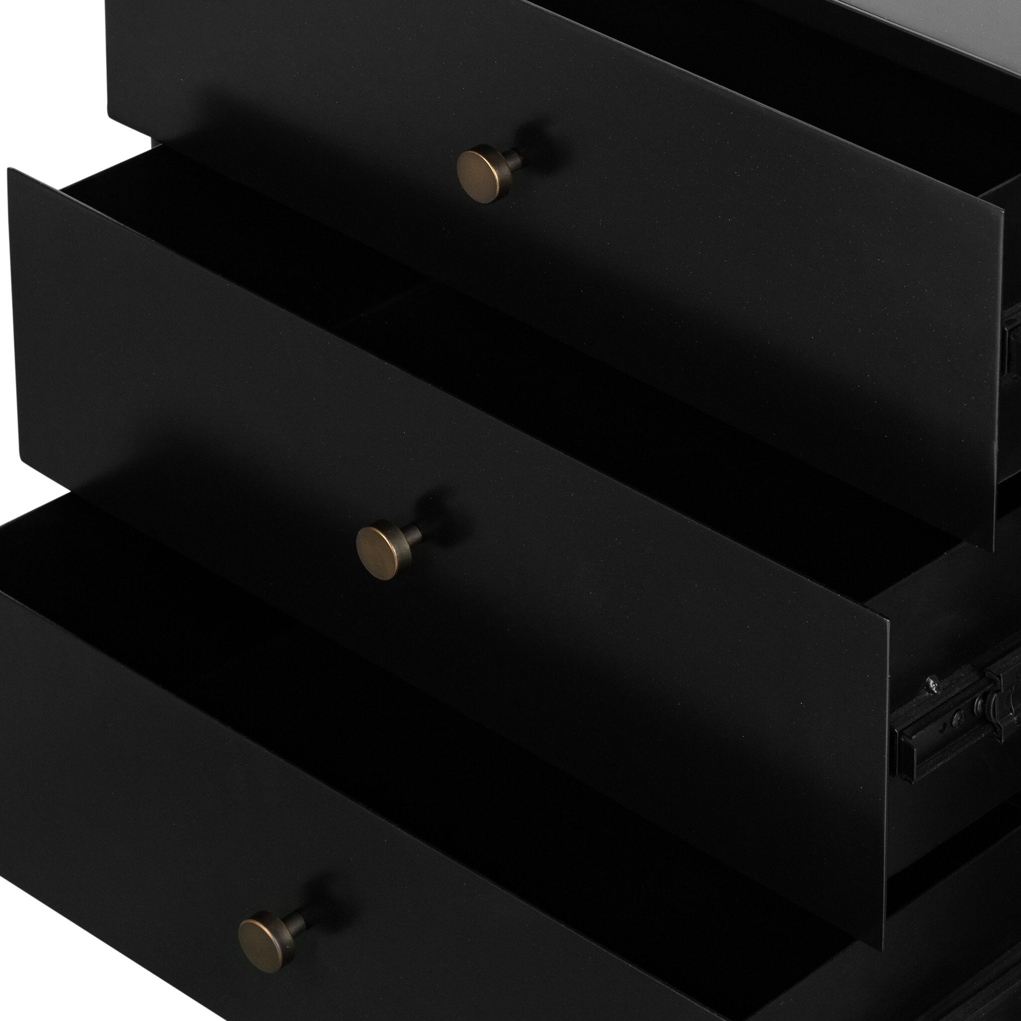 Black dresser with open drawers and bronze knobs on a white background