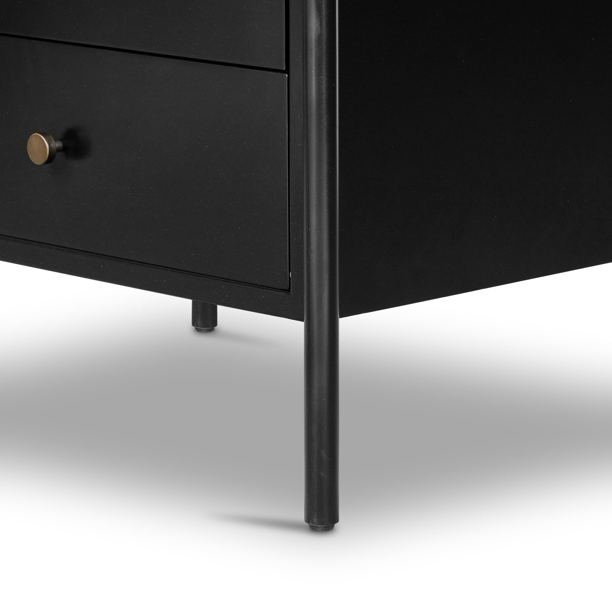 Black dresser with a metal leg on a white background