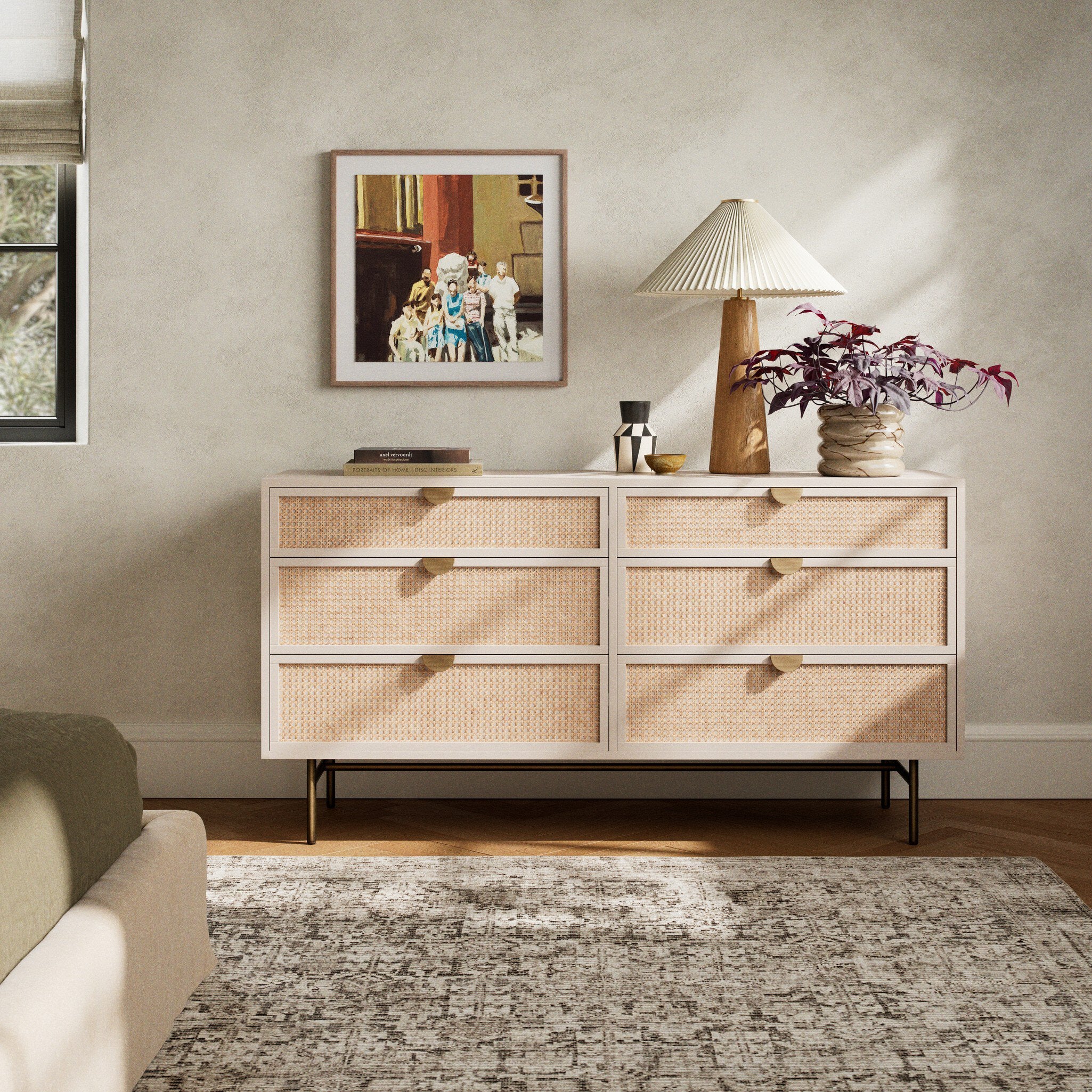 Wicker dresser in a living room with decor items on top