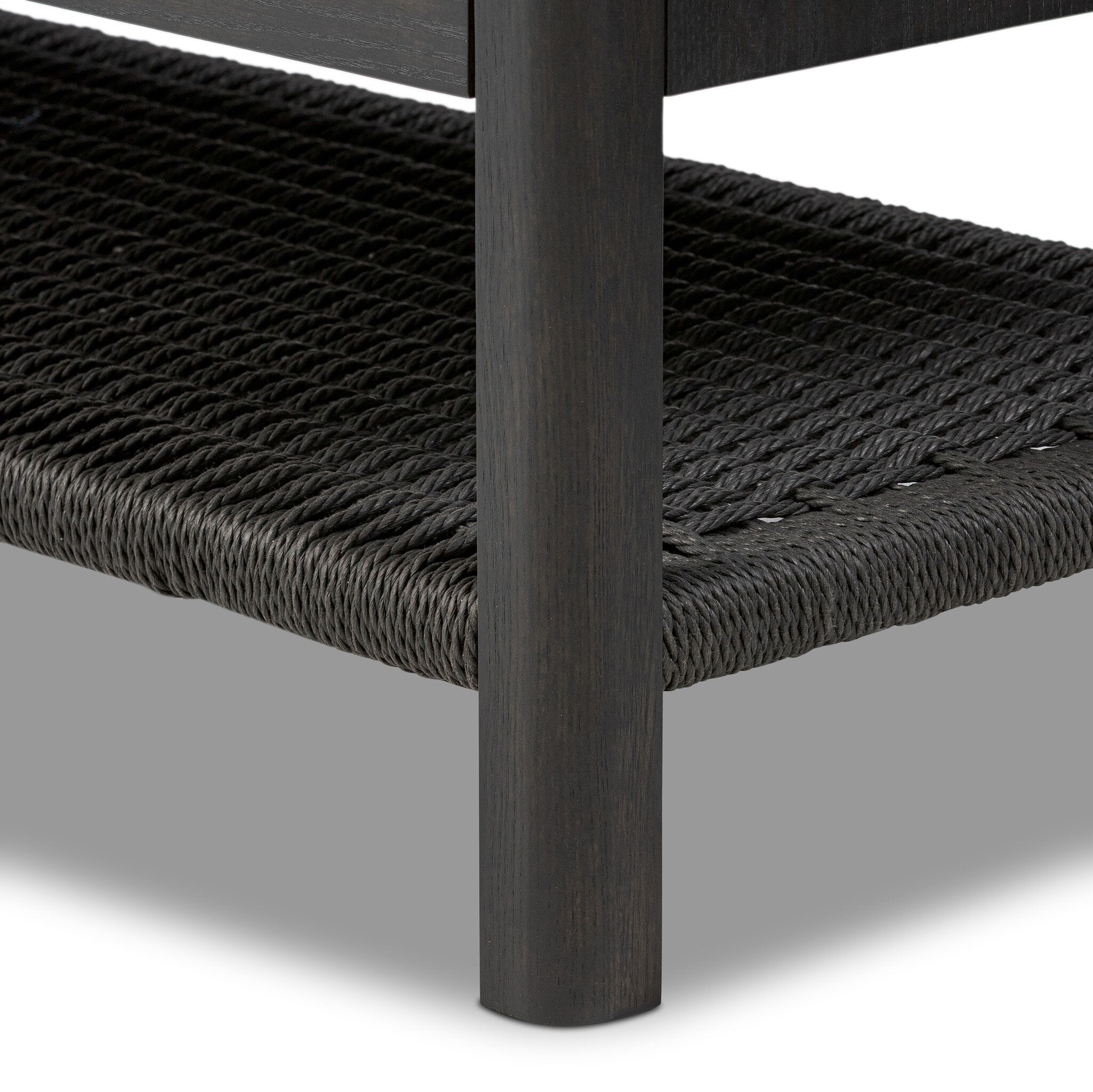 Black dresser with multiple drawers on a white background