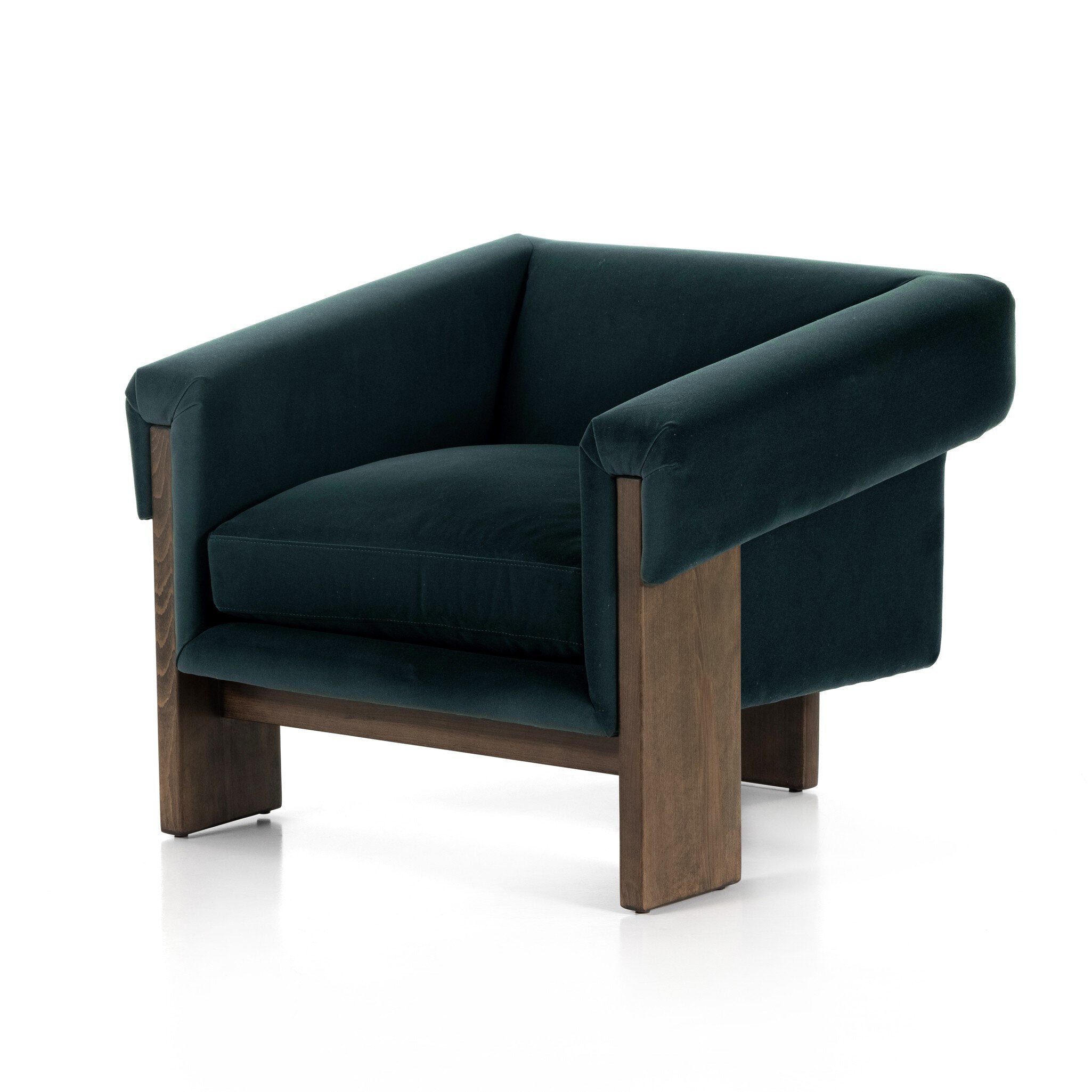 Green velvet armchair with wooden legs on a white background