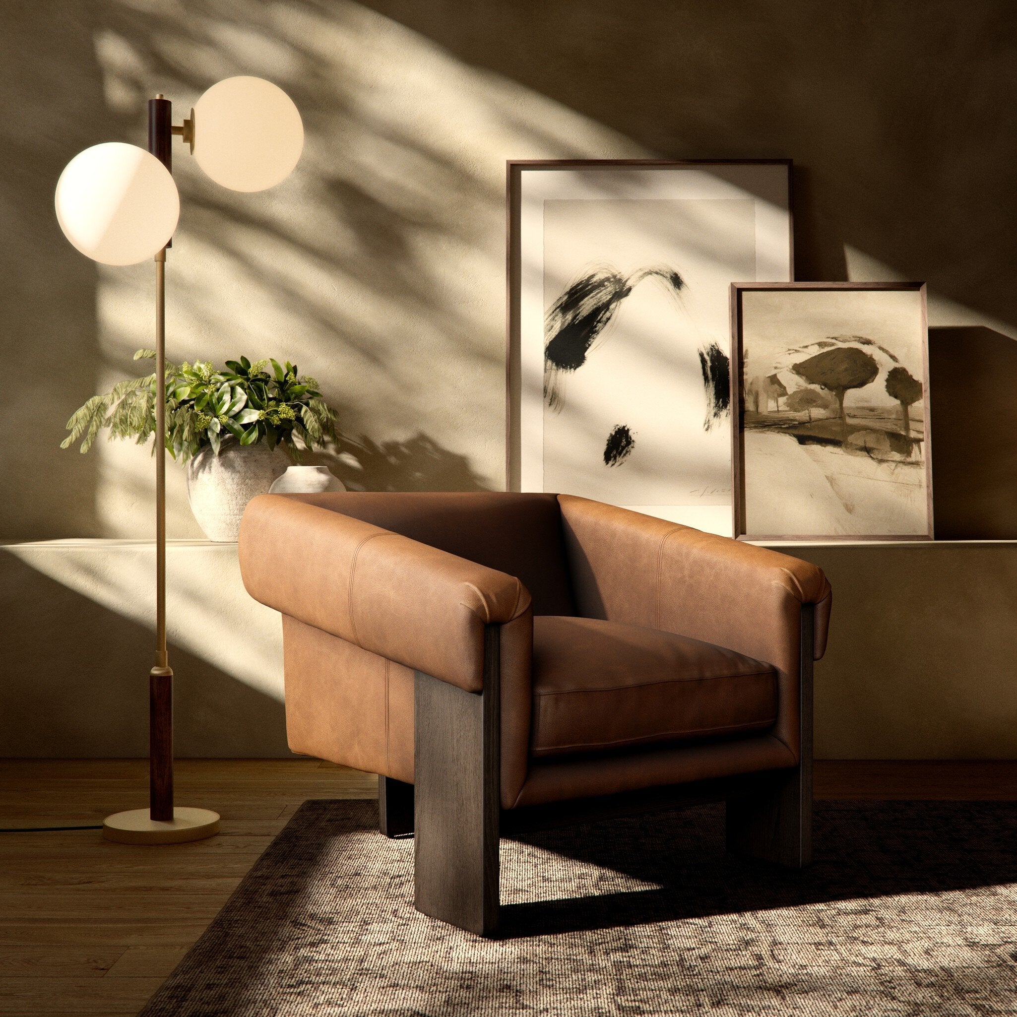 Brown leather armchair in a room with a floor lamp, plant, and wall art.