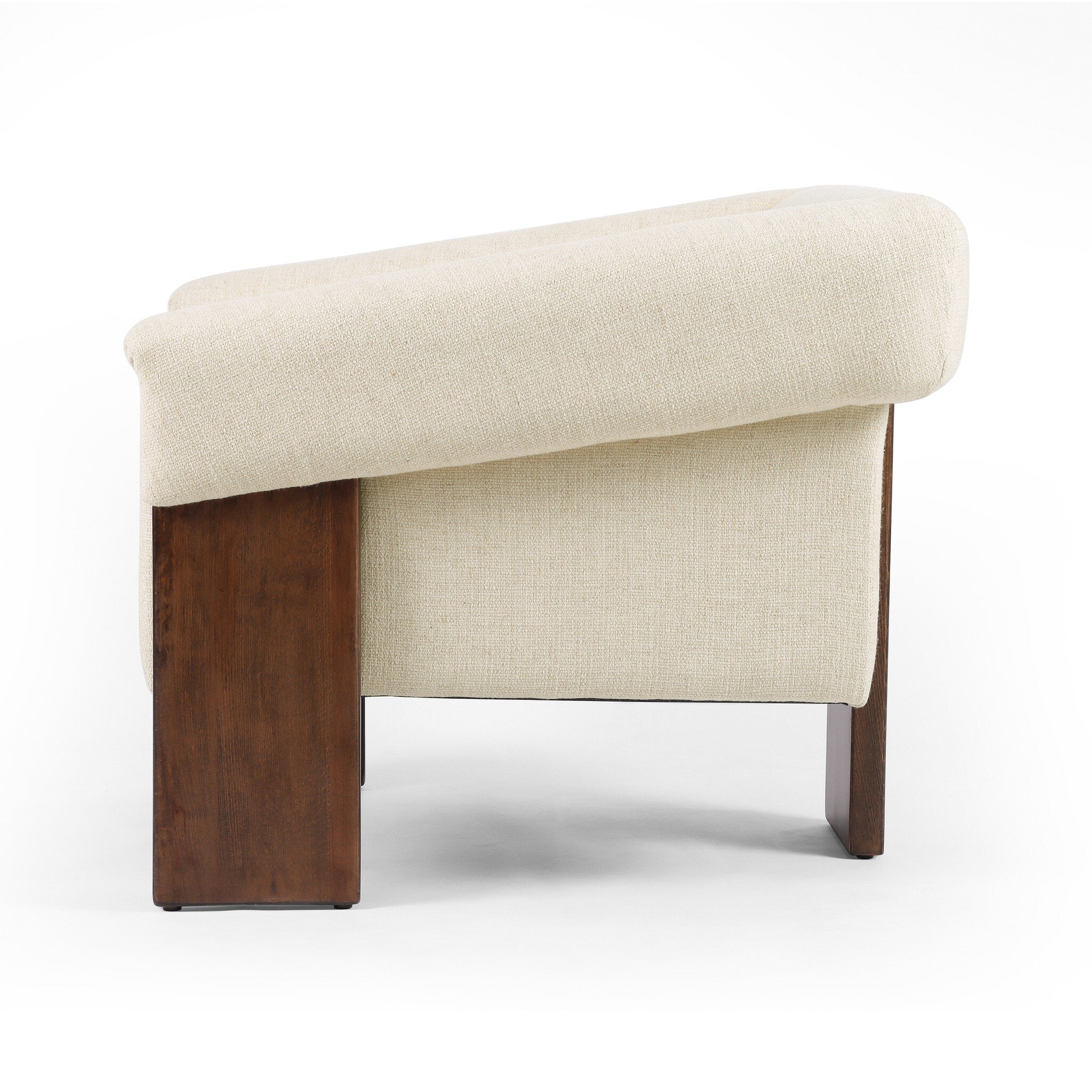 Beige cushioned bench with wooden legs on a white background