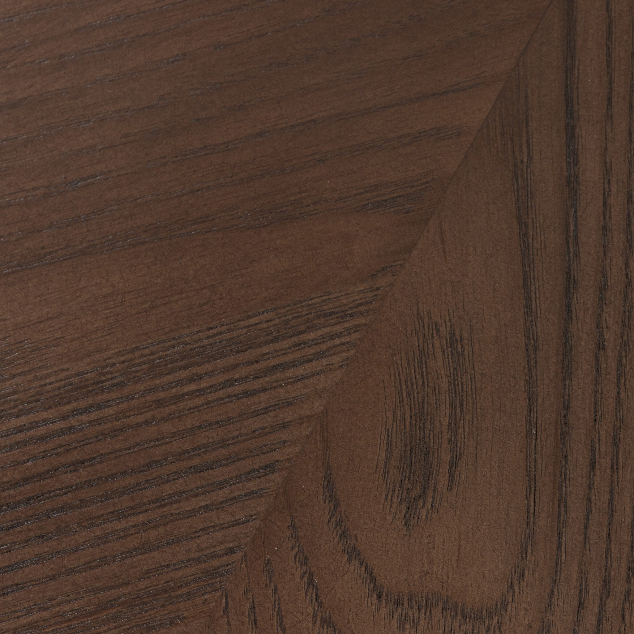 Close-up of a brown wooden surface with visible grain.