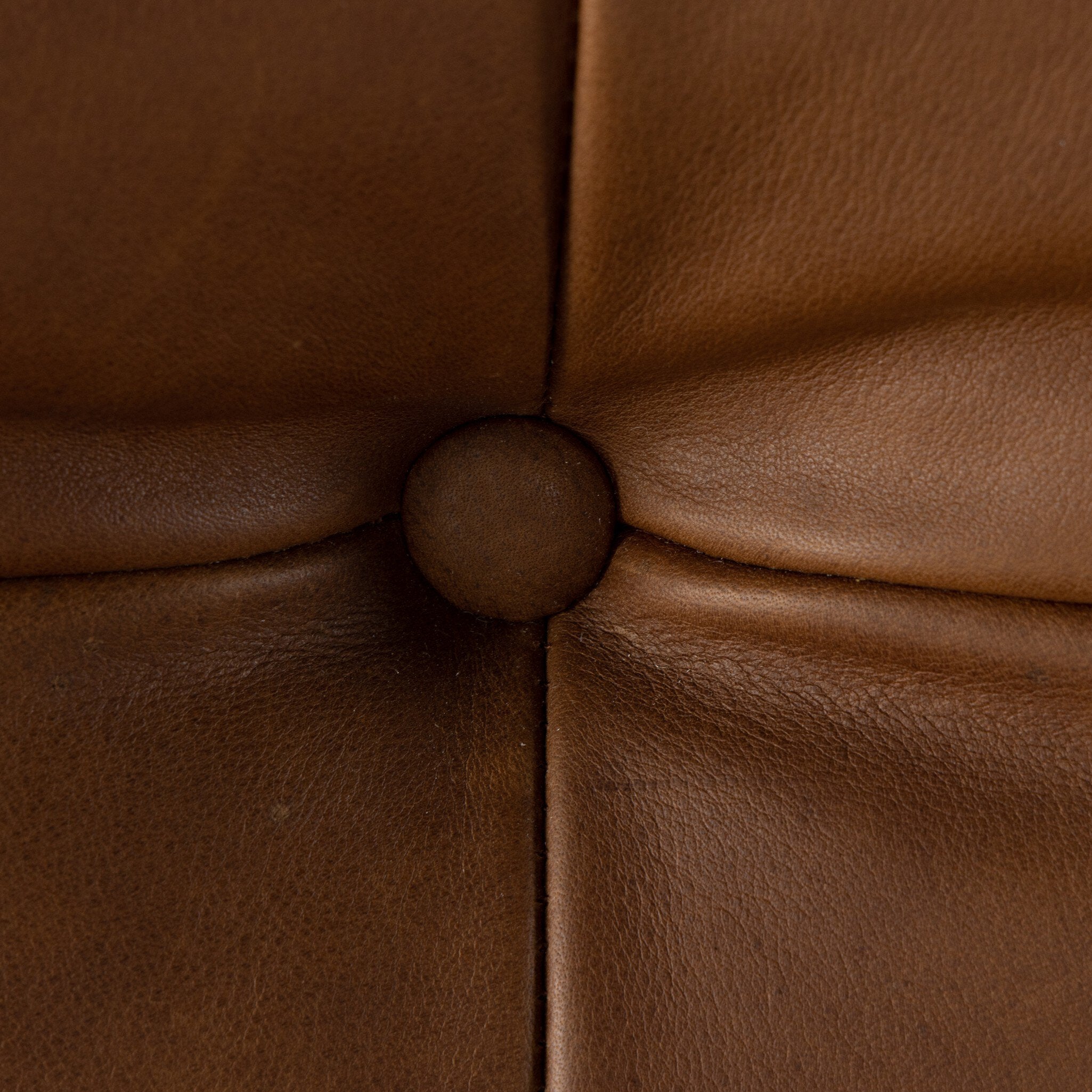 Close-up of brown leather with a visible stitching detail