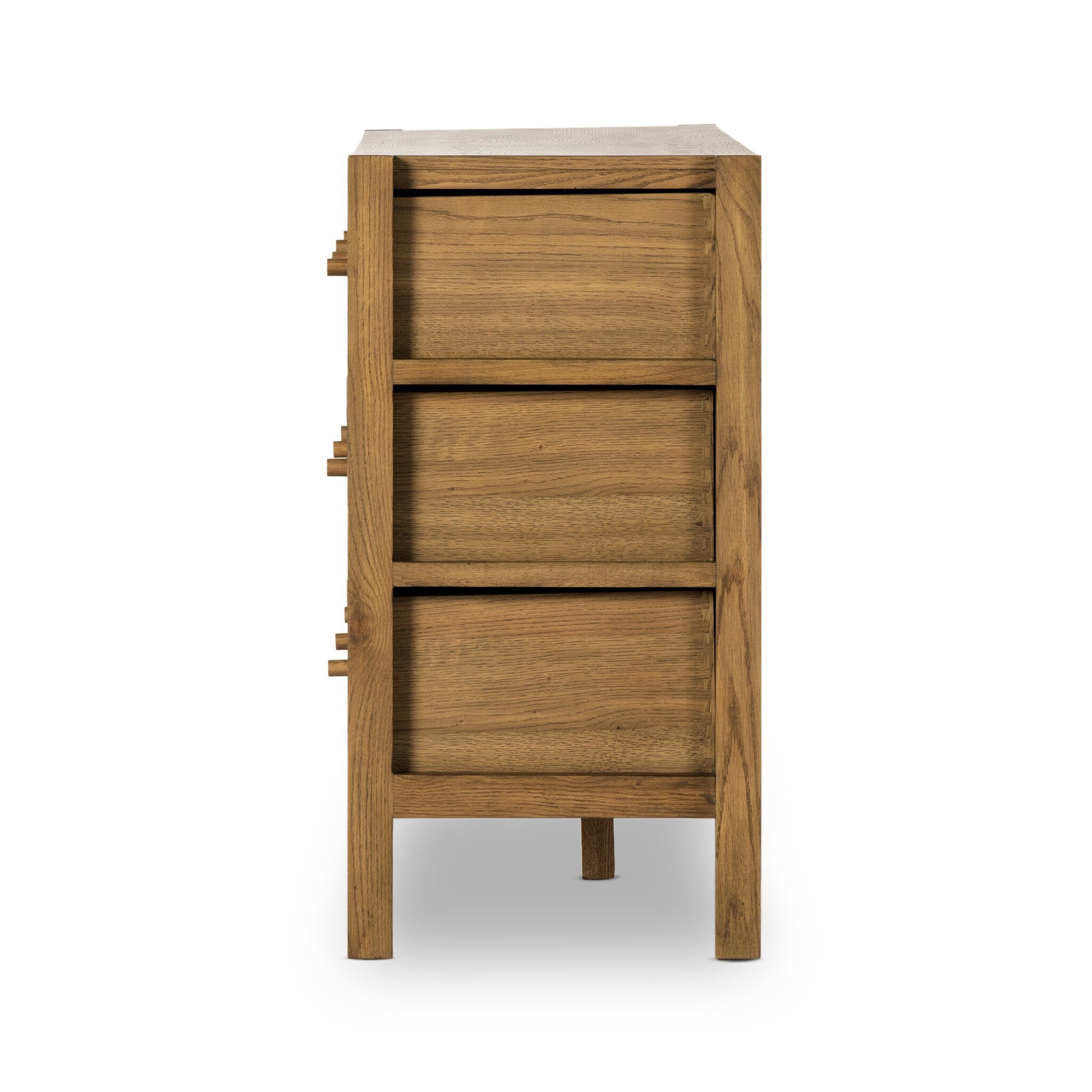 Wooden cabinet with three drawers on a white background