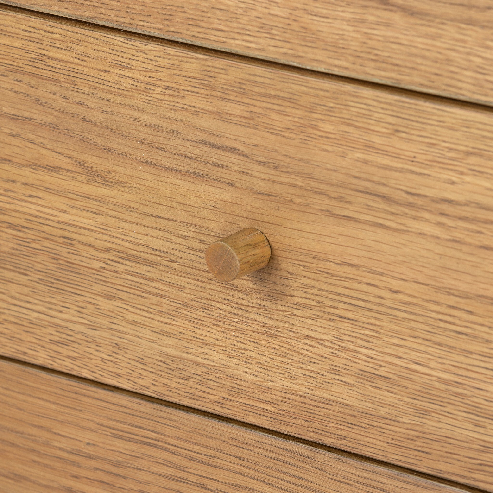 Close-up of a wooden drawer with a knob