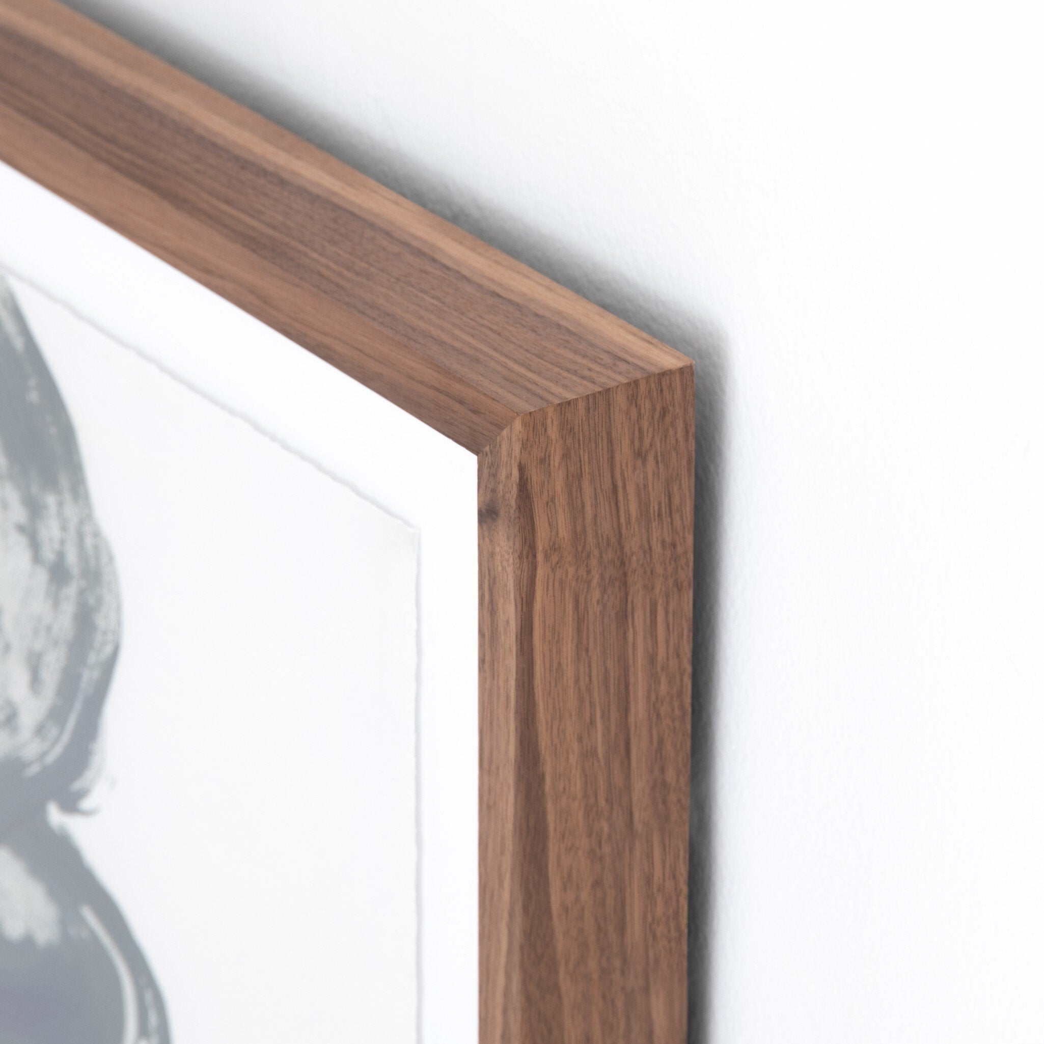 Close-up of a wooden frame corner on a white background