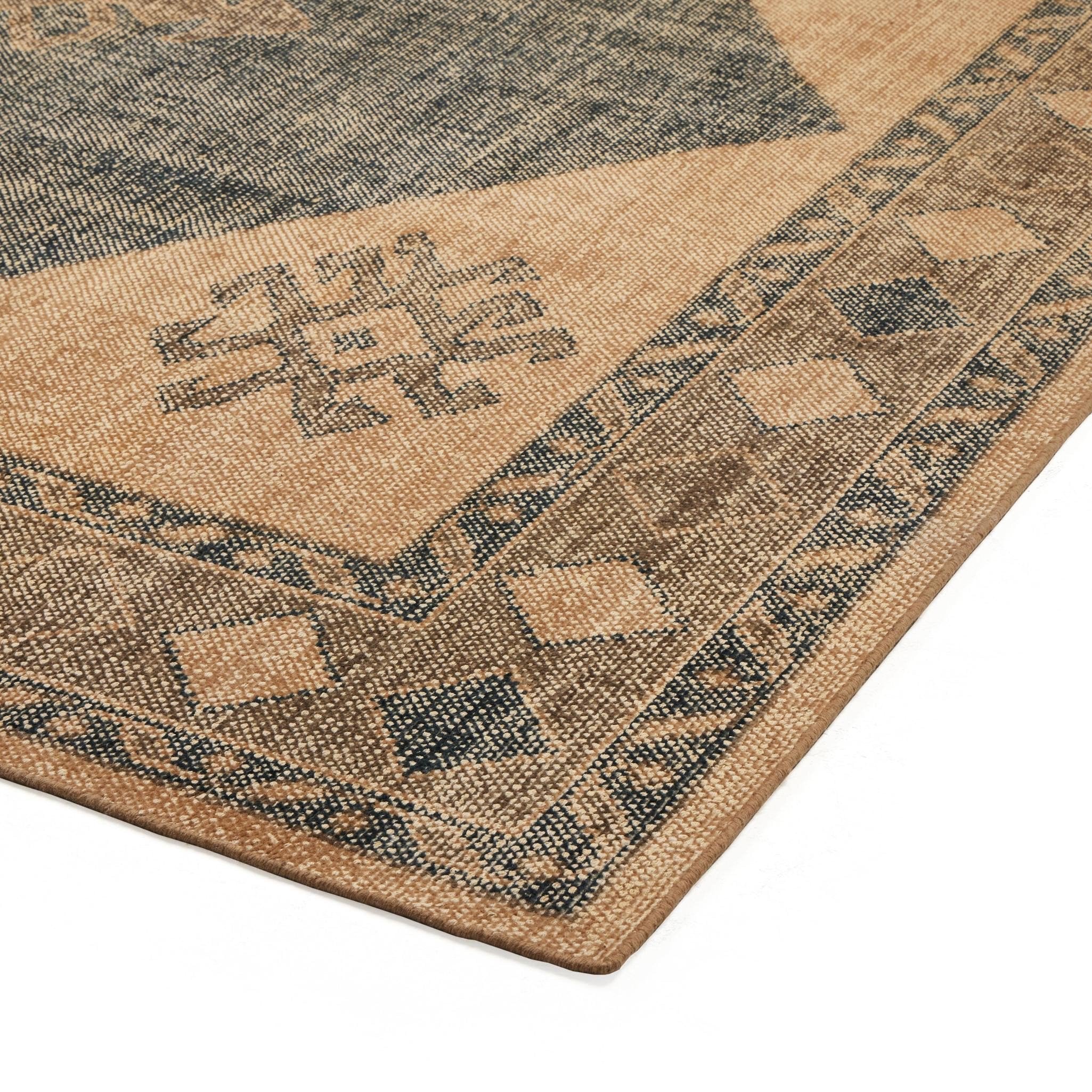 Close-up of a textured rug with geometric pattern
