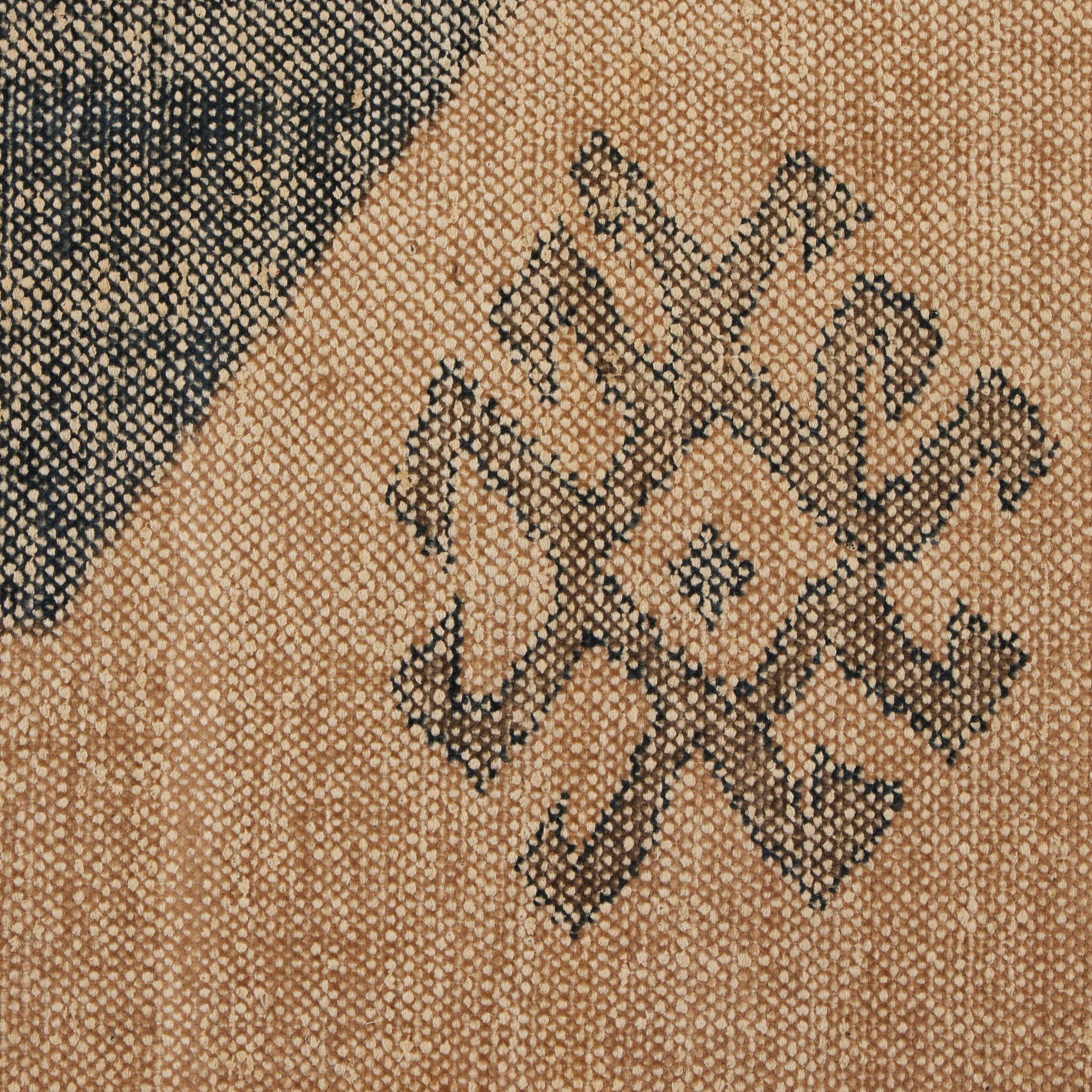 Textured brown surface with black geometric pattern