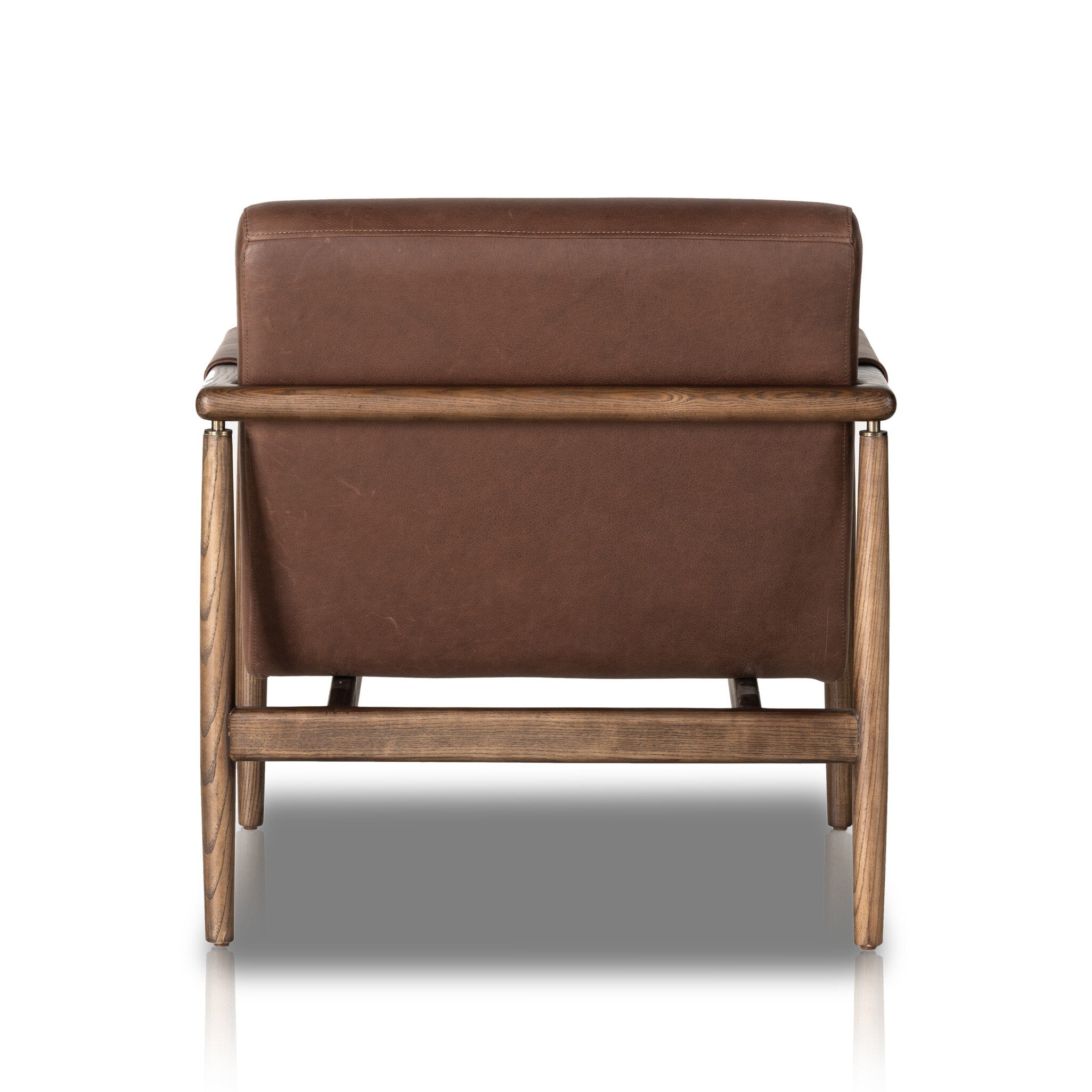 Brown leather armchair with wooden frame on white background
