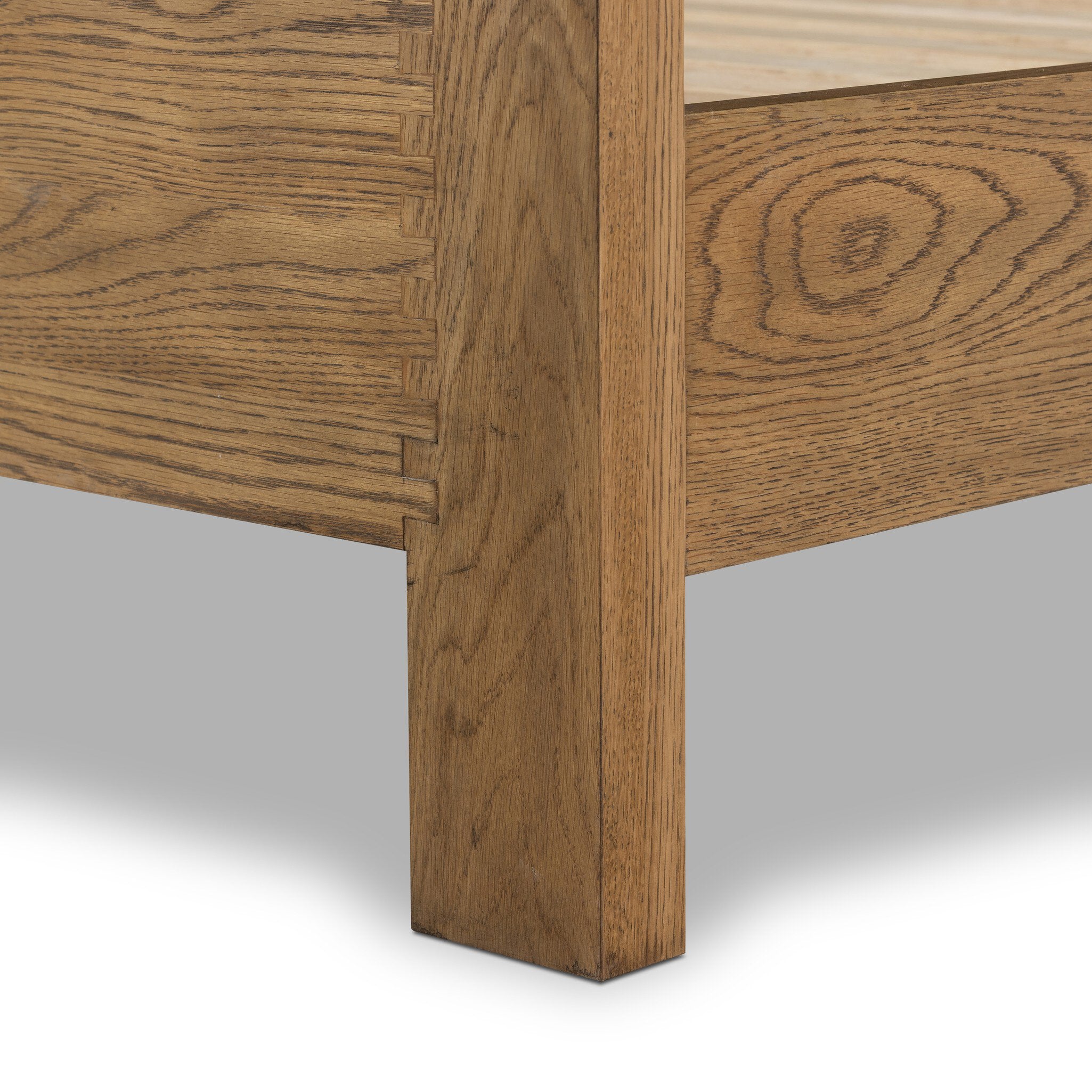 Close-up of a wooden bed frame corner