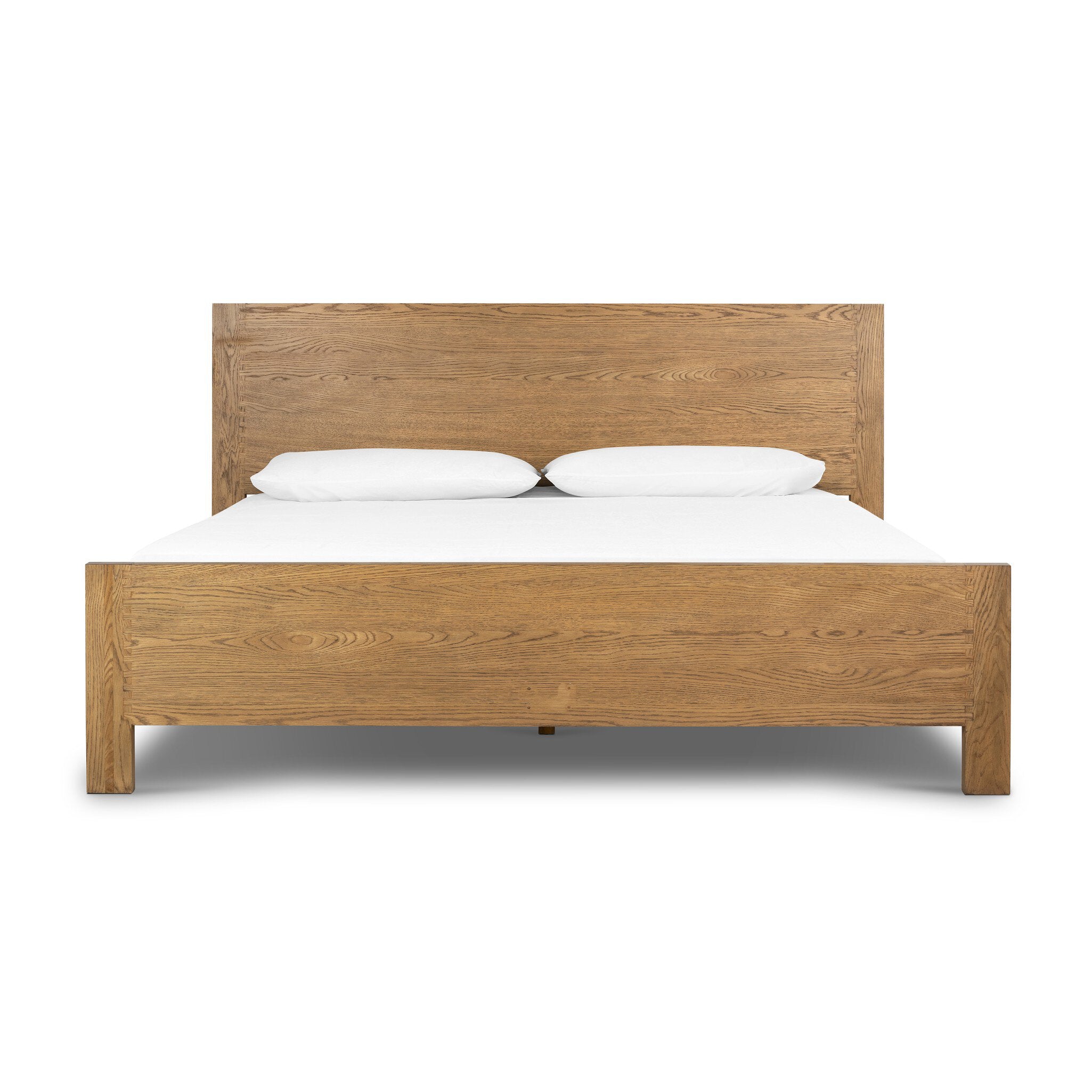 Wooden bed with white bedding