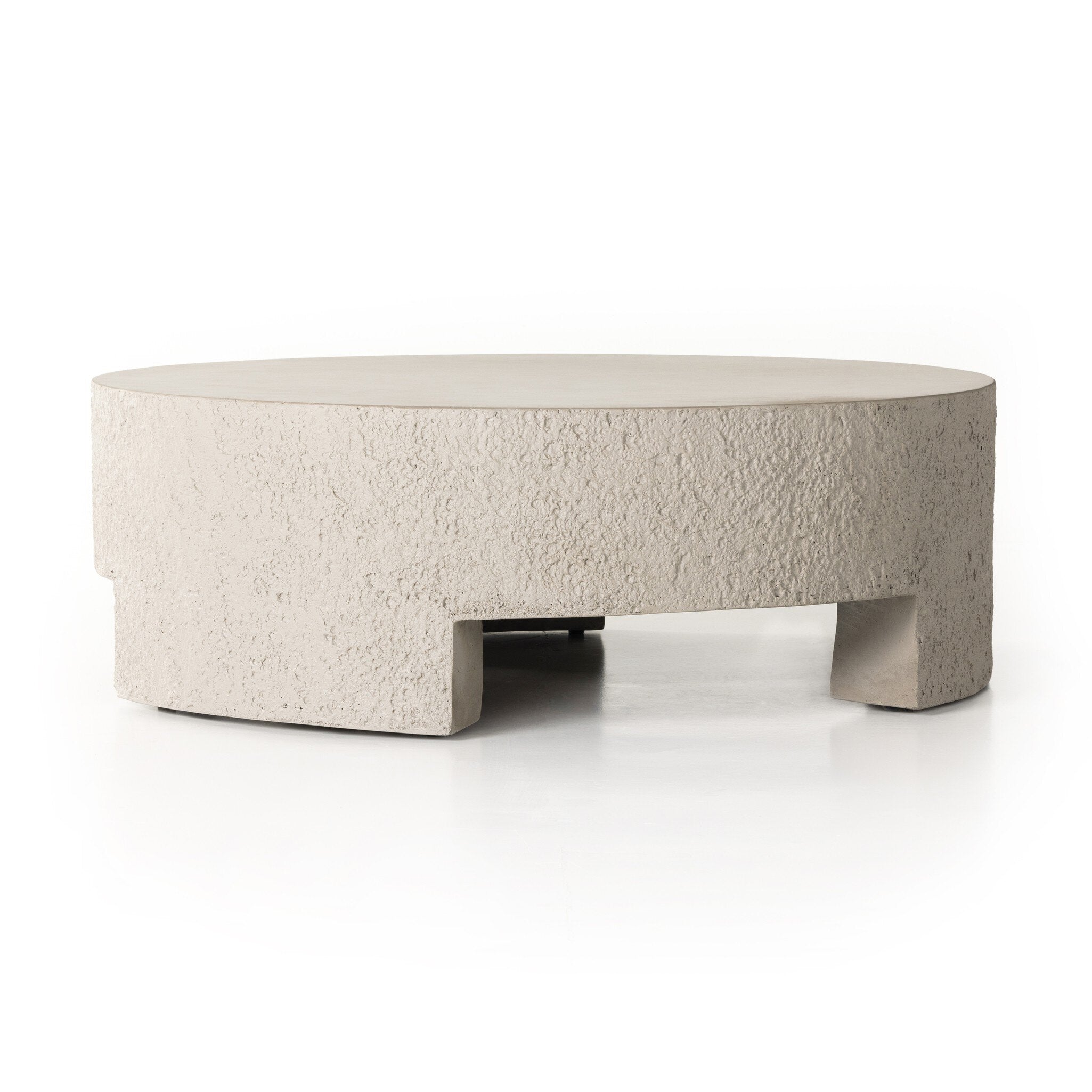 Round outdoor concrete coffee table on a white background