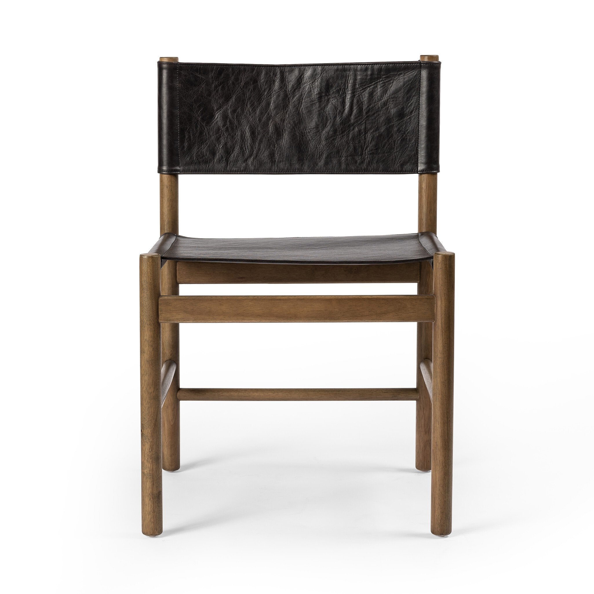 Dining chair with black leather backrest and seat on a white background