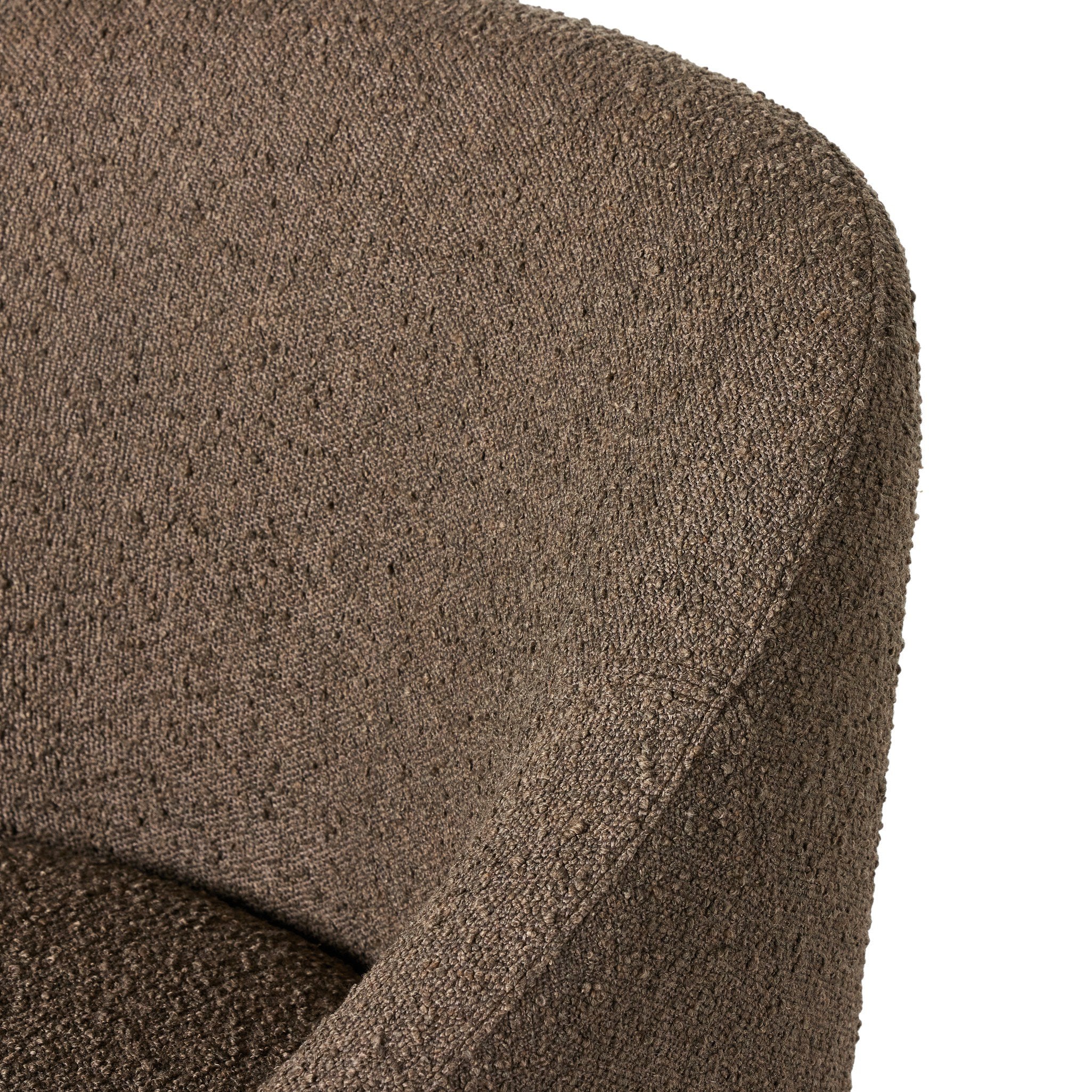 Close-up of a textured brown fabric surface