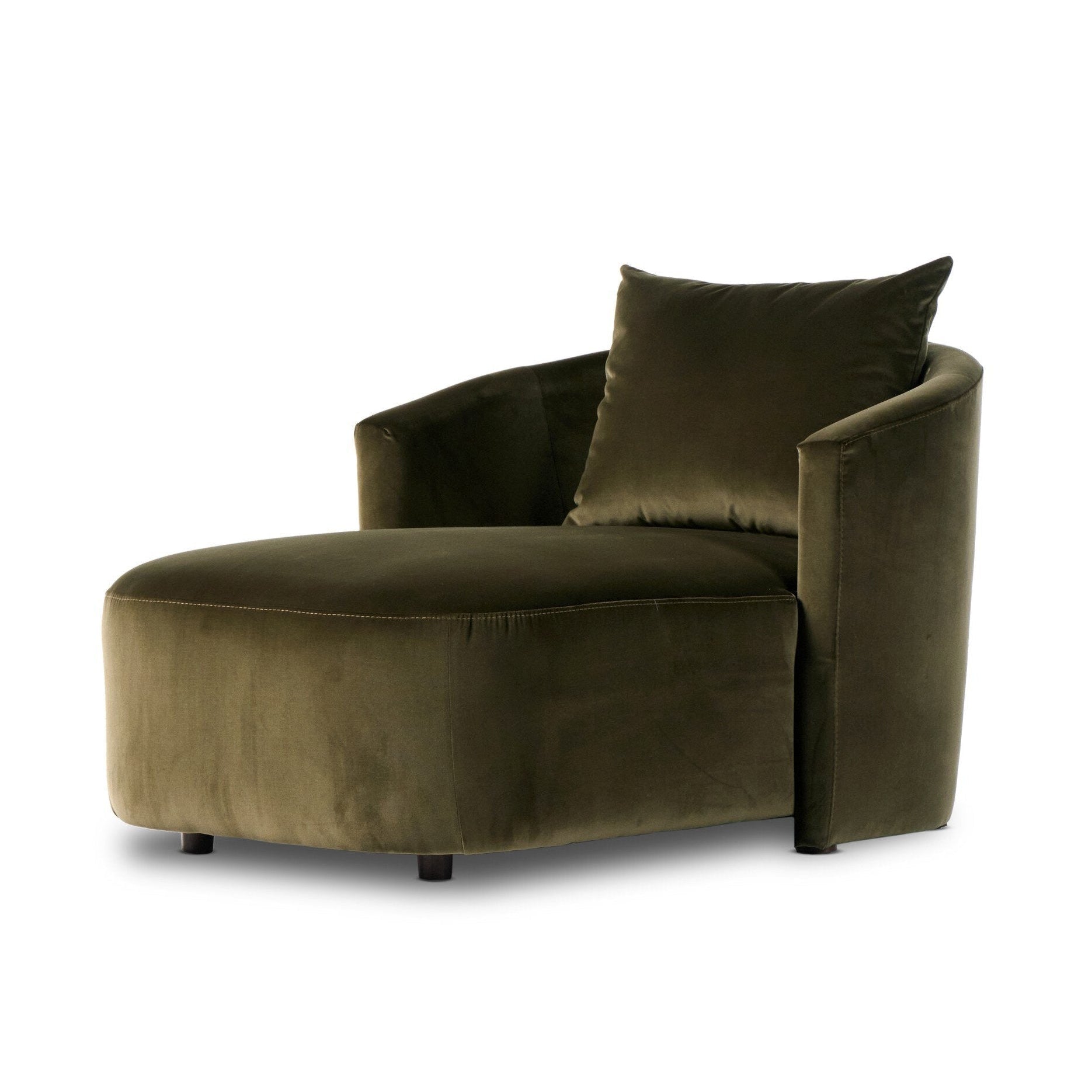 Brown velvet armchair with a pillow