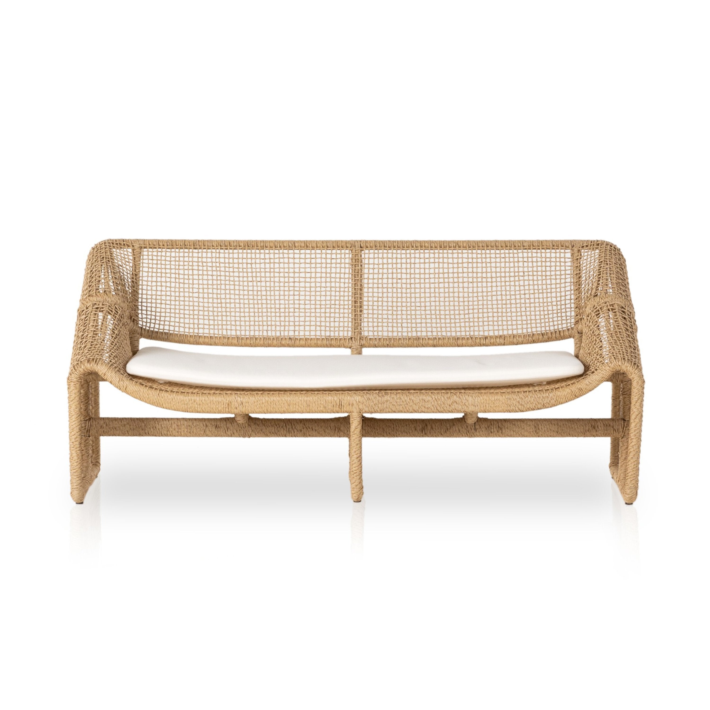 Woven outdoor sofa with white cushion on a white background