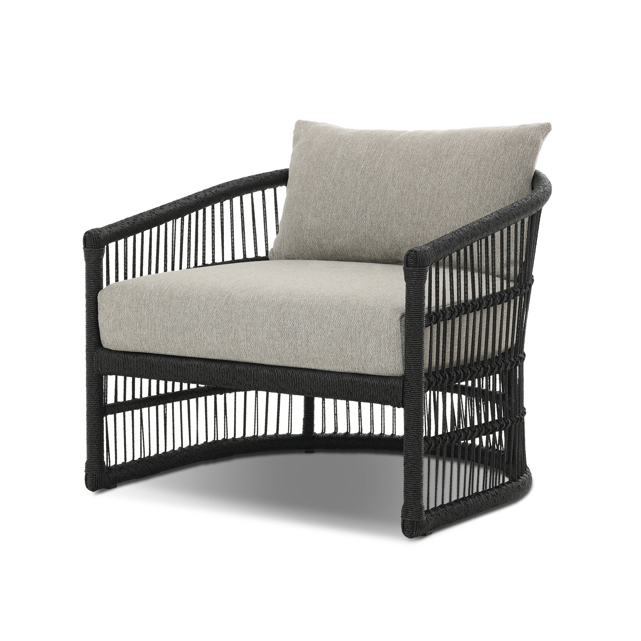 Wicker chair with beige cushion on a white background