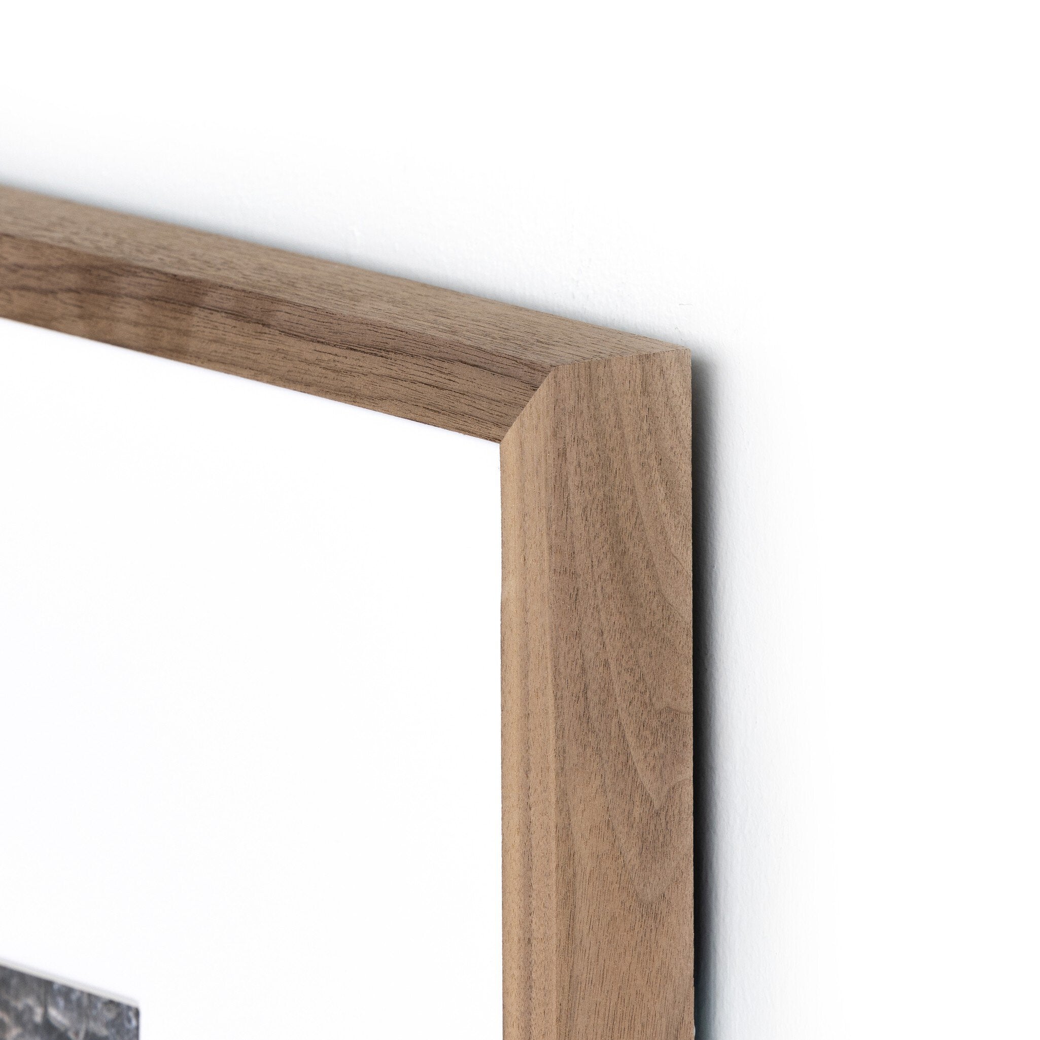 Close-up of a wooden frame corner on a white background