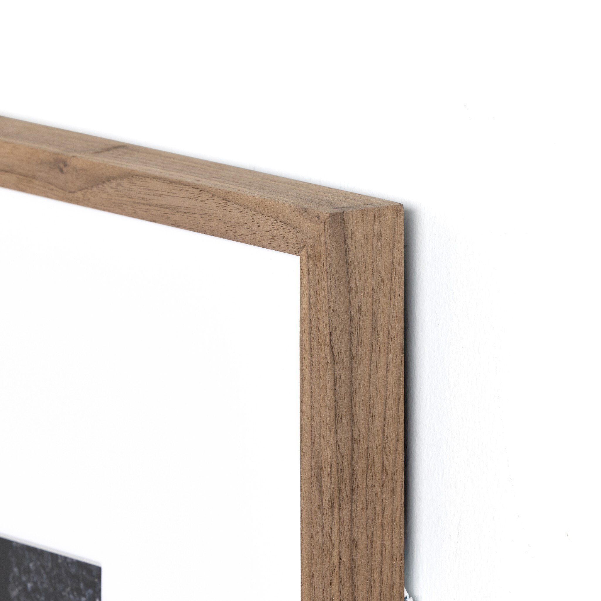 Close-up of a wooden frame corner on a white background