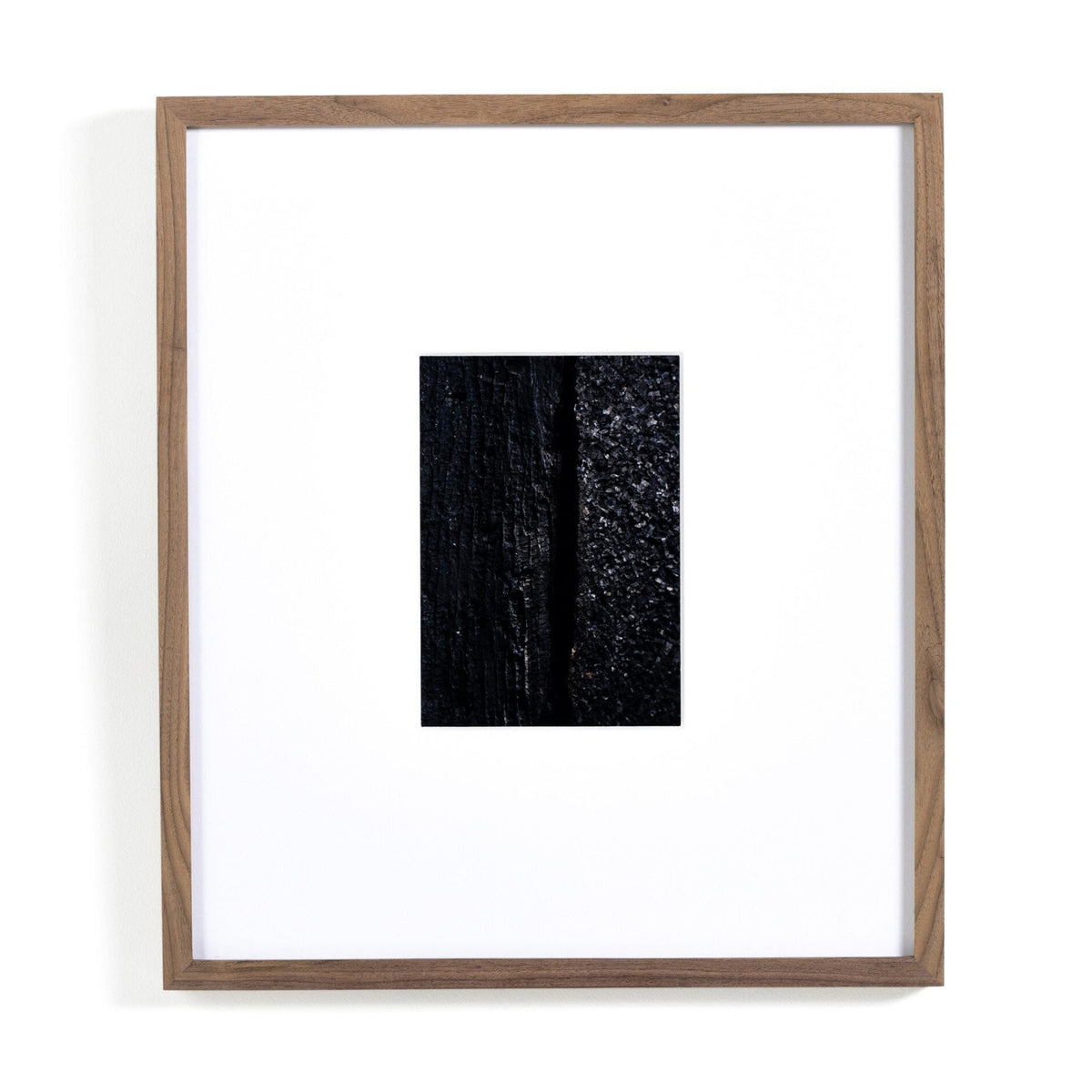Framed artwork with a black rectangular print inside on a white background