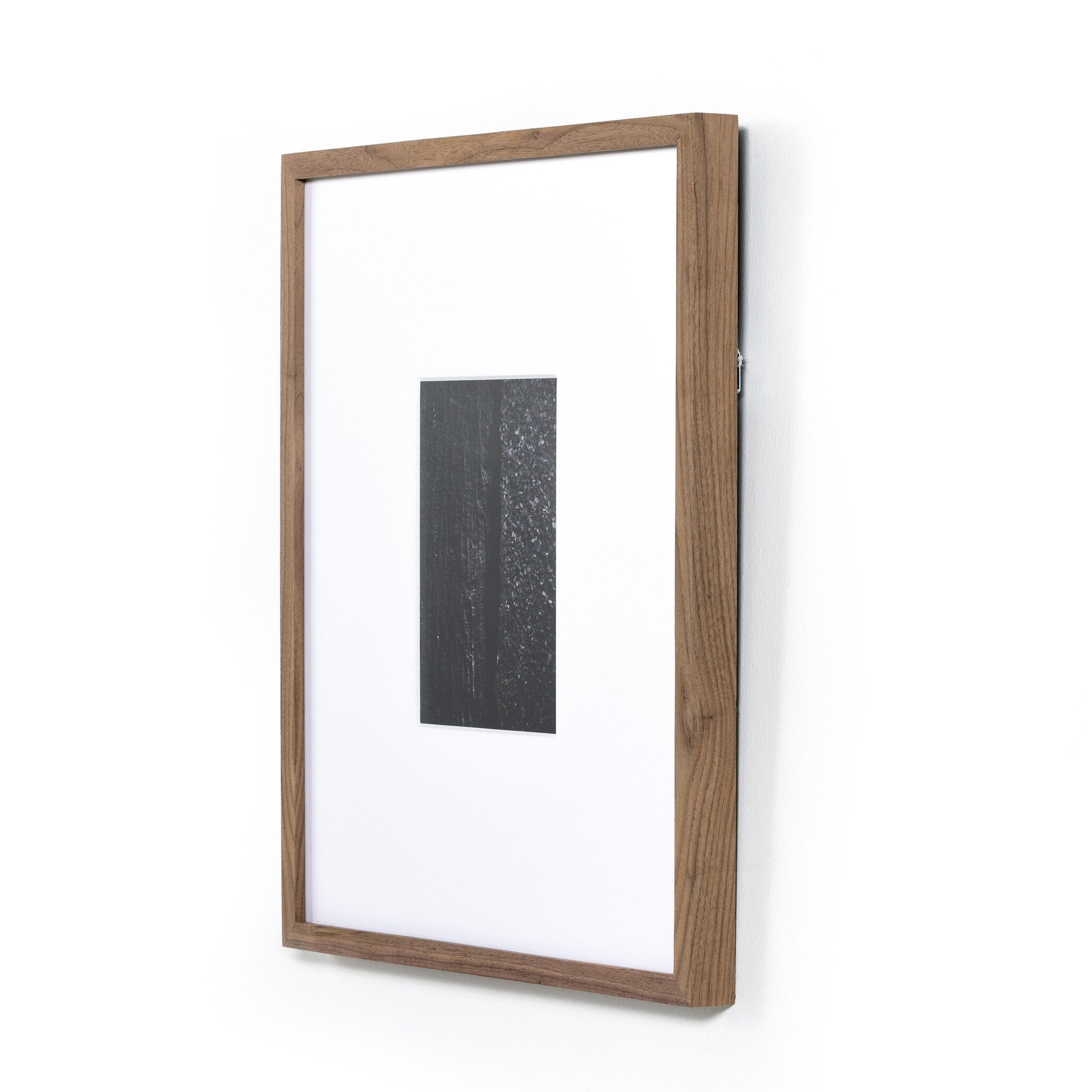 Wooden picture frame with a white mat and black artwork on a white background