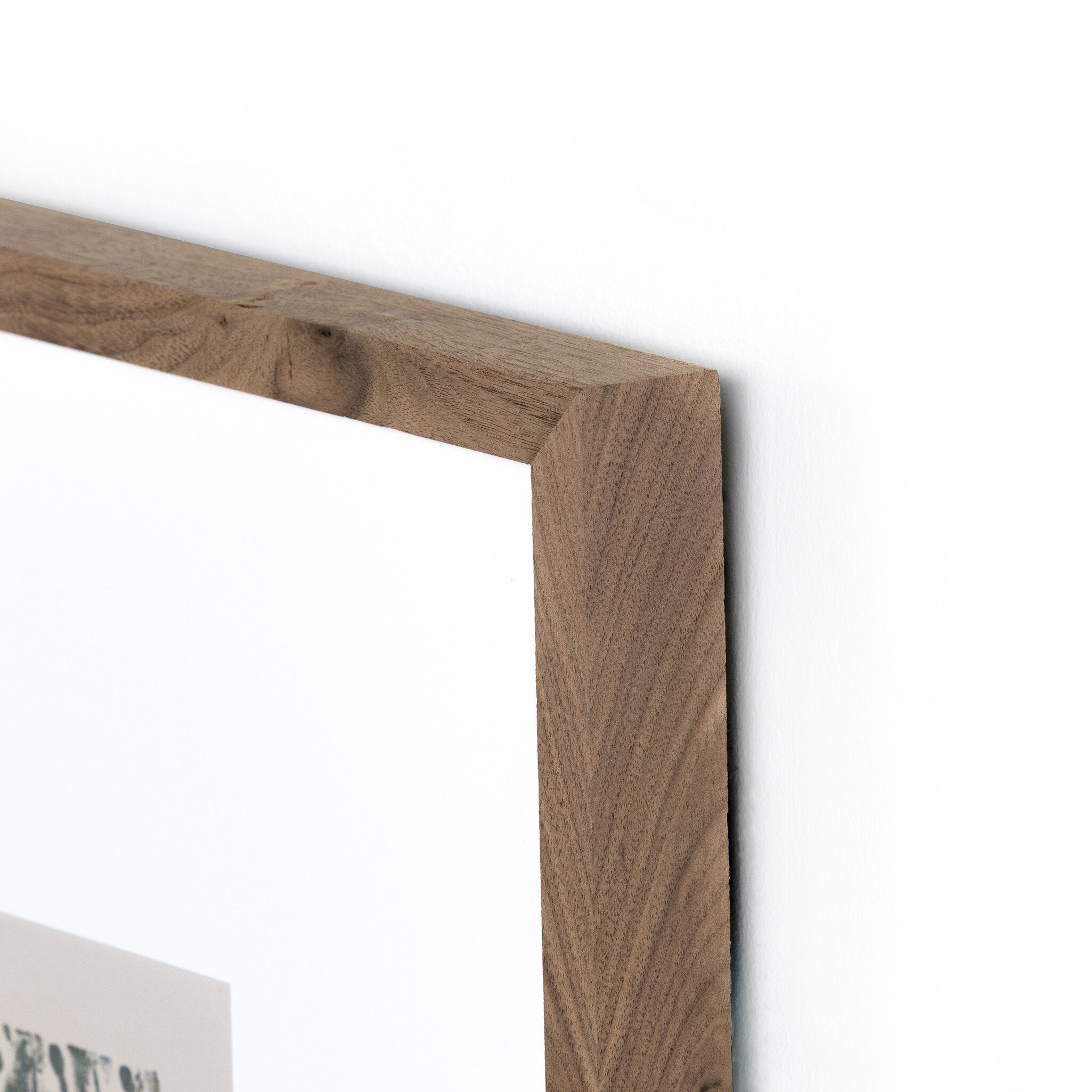 Close-up of a wooden frame corner on a white background