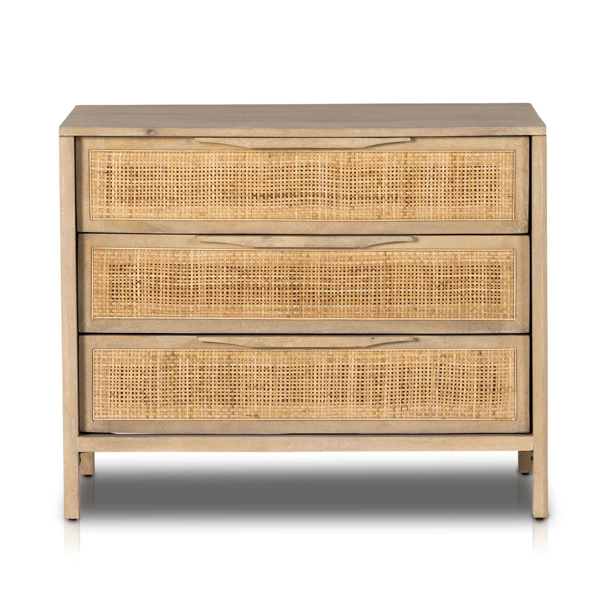 Three-drawer dresser with rattan drawers on a white background
