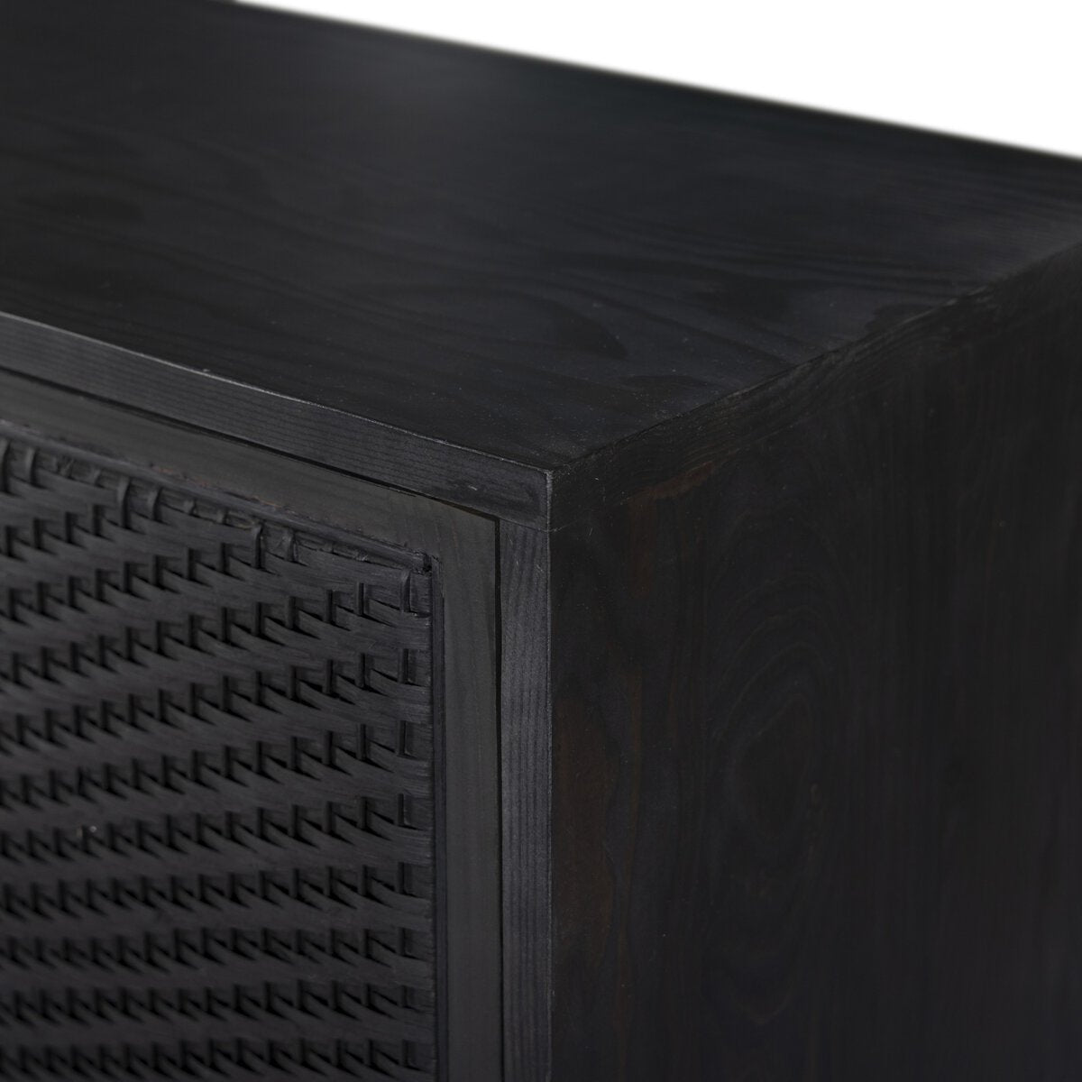 Close-up of a dark wooden surface with textured patterns