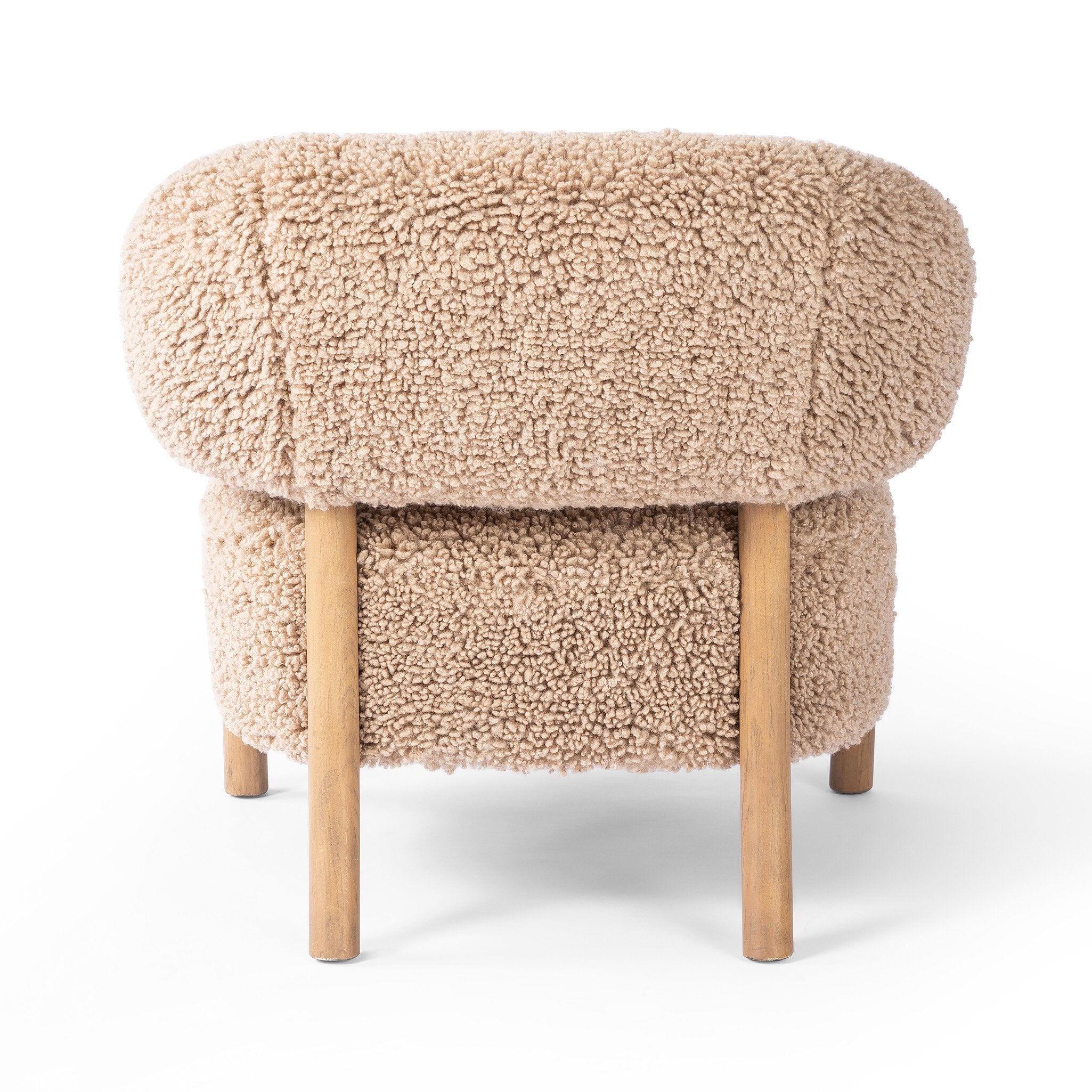 Beige fluffy chair with wooden legs on a white background