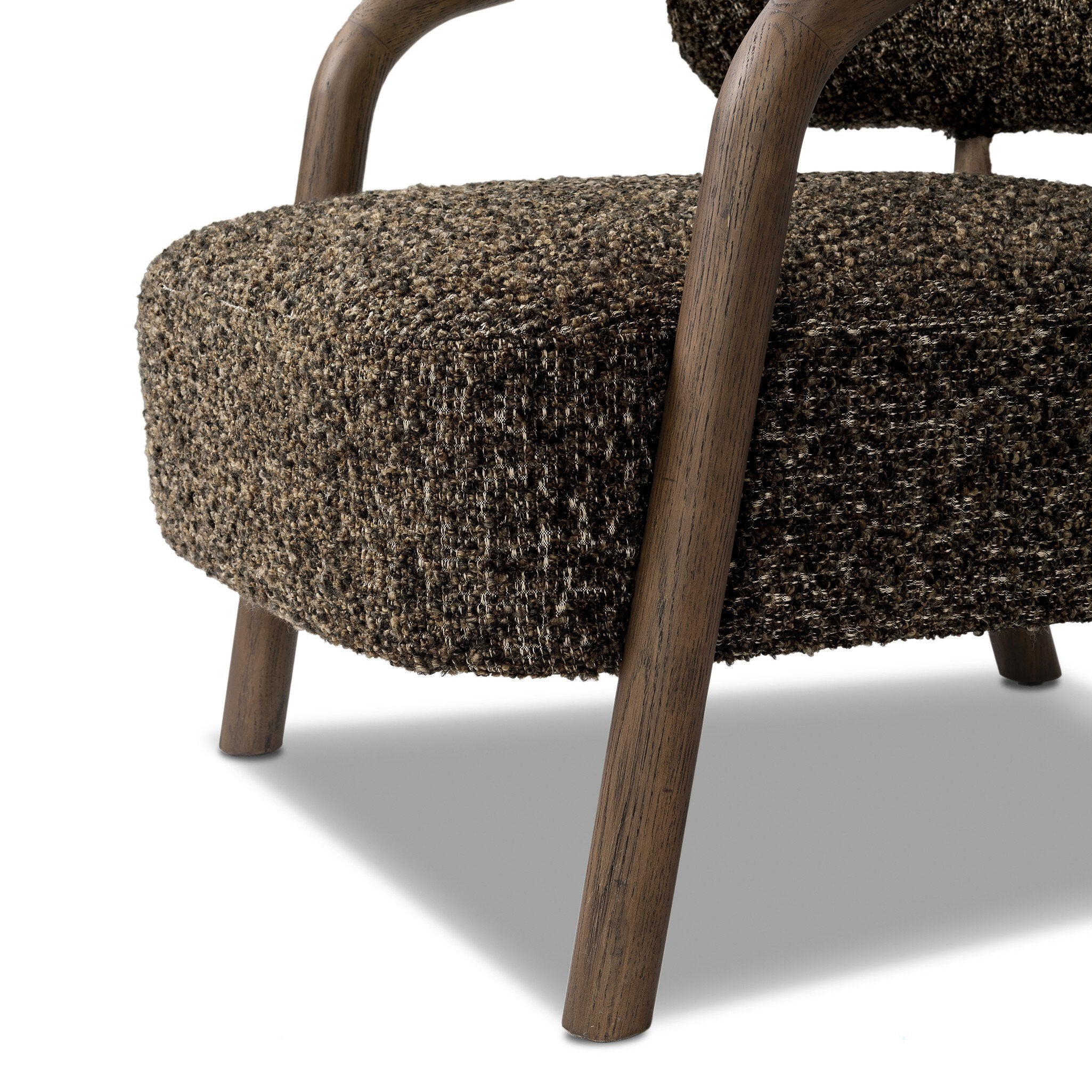 Brown textured armchair with wooden legs on a white background