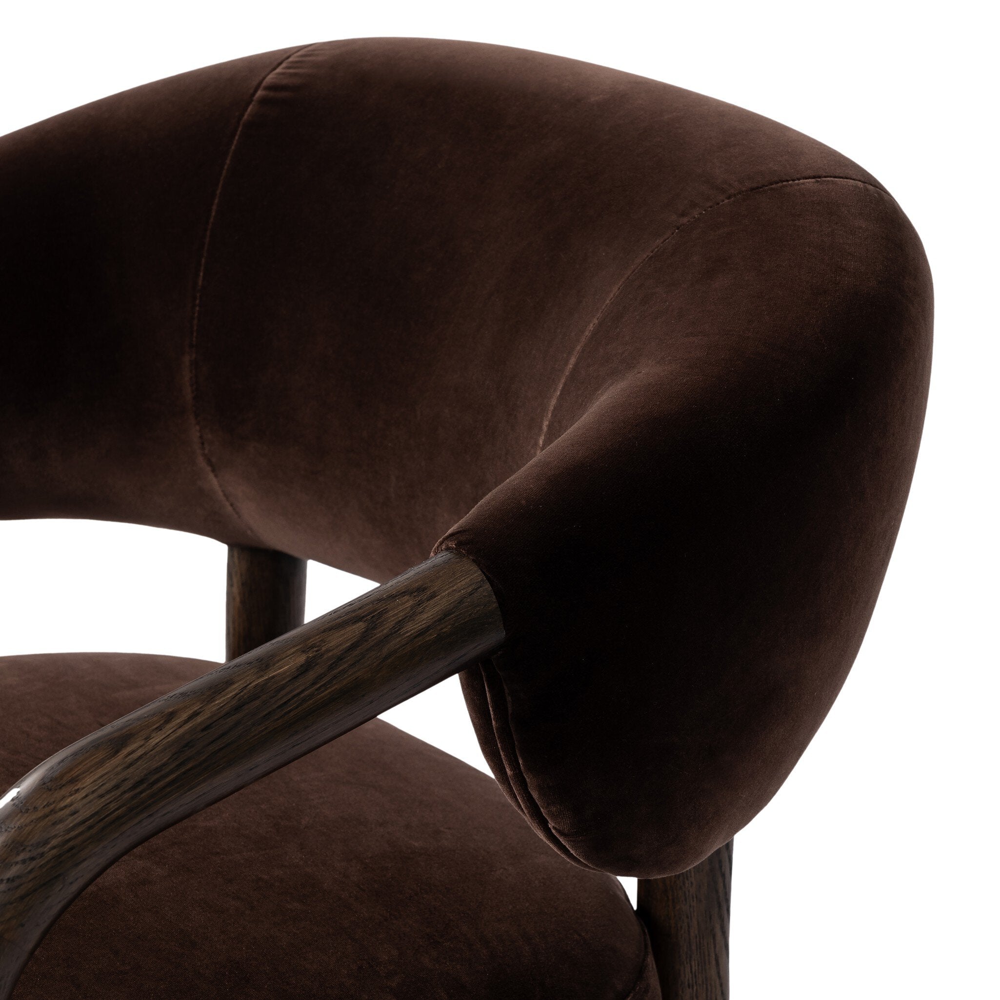 Close-up of a brown upholstered chair with a wooden armrest on a white background