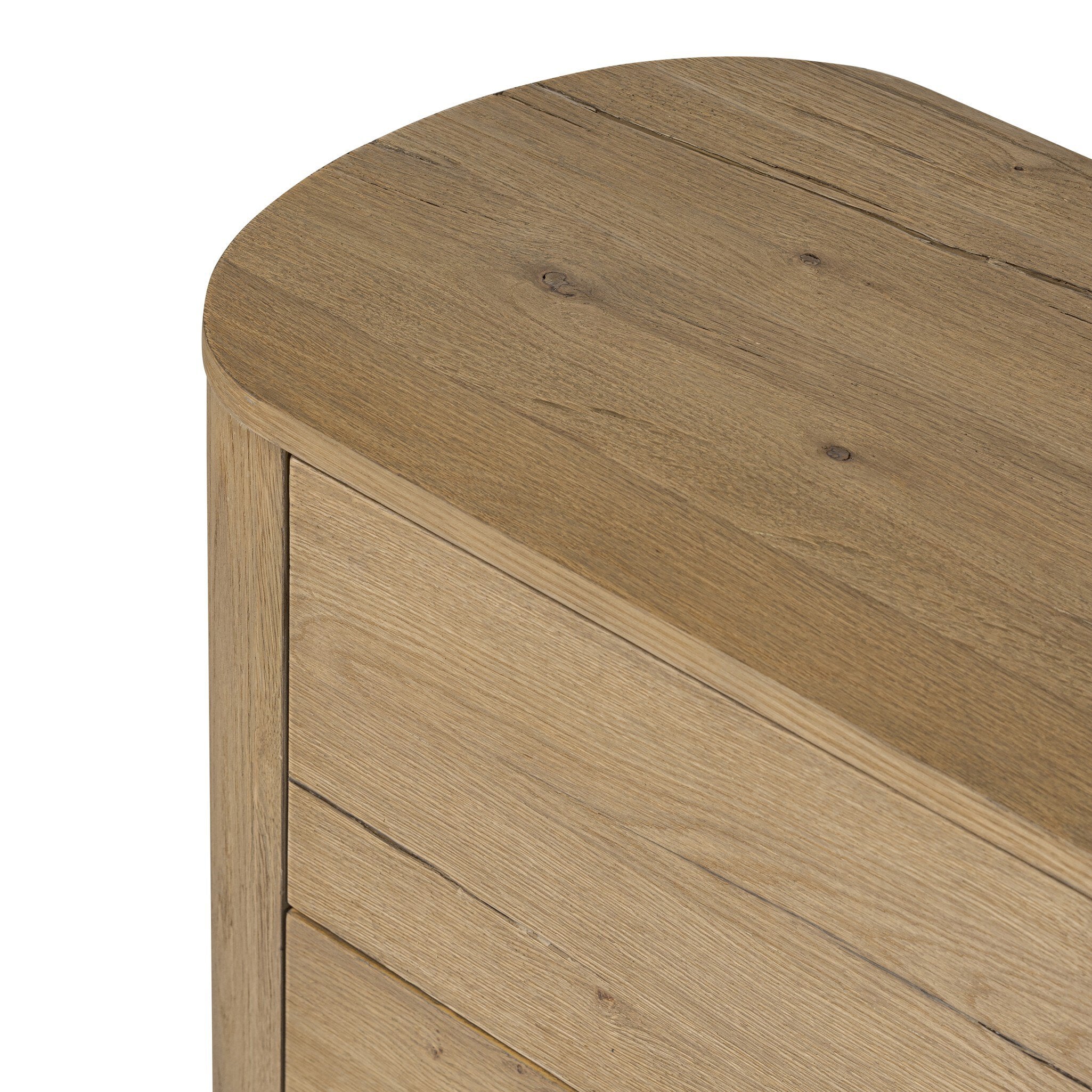 Close-up of a wooden side table with a natural finish.
