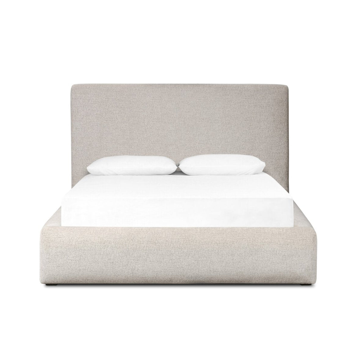 Beige upholstered bed with white bedding on a white background