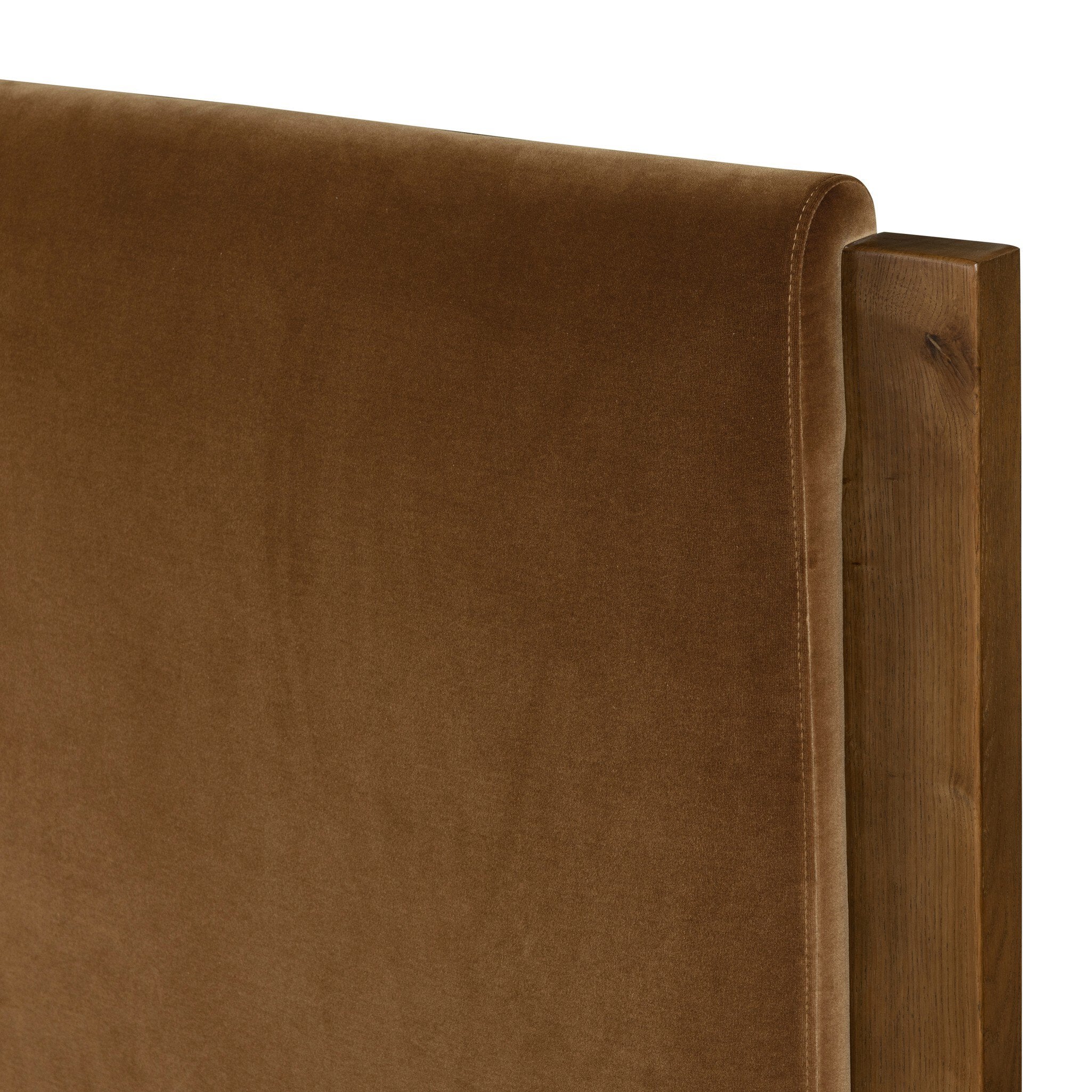 Brown upholstered headboard corner on a white background