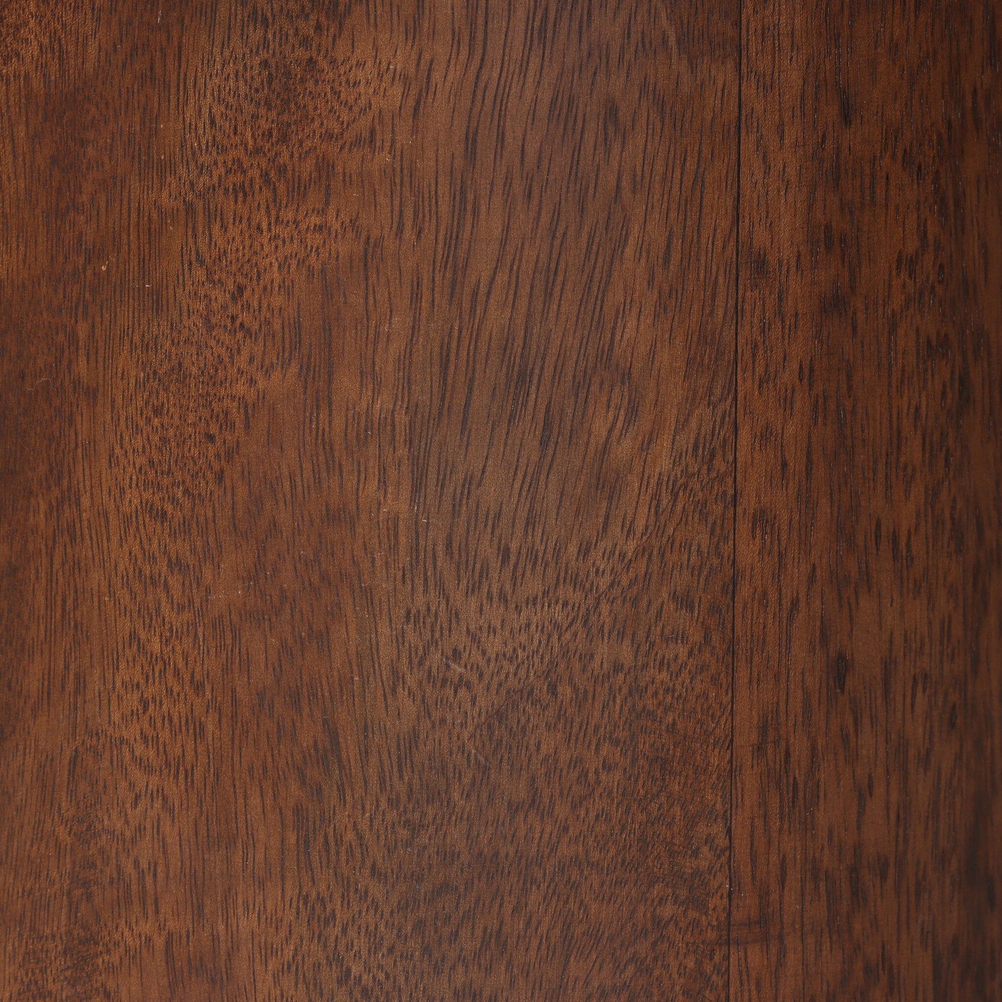Close-up of a wooden lamp base with a rich brown color and visible grain pattern.