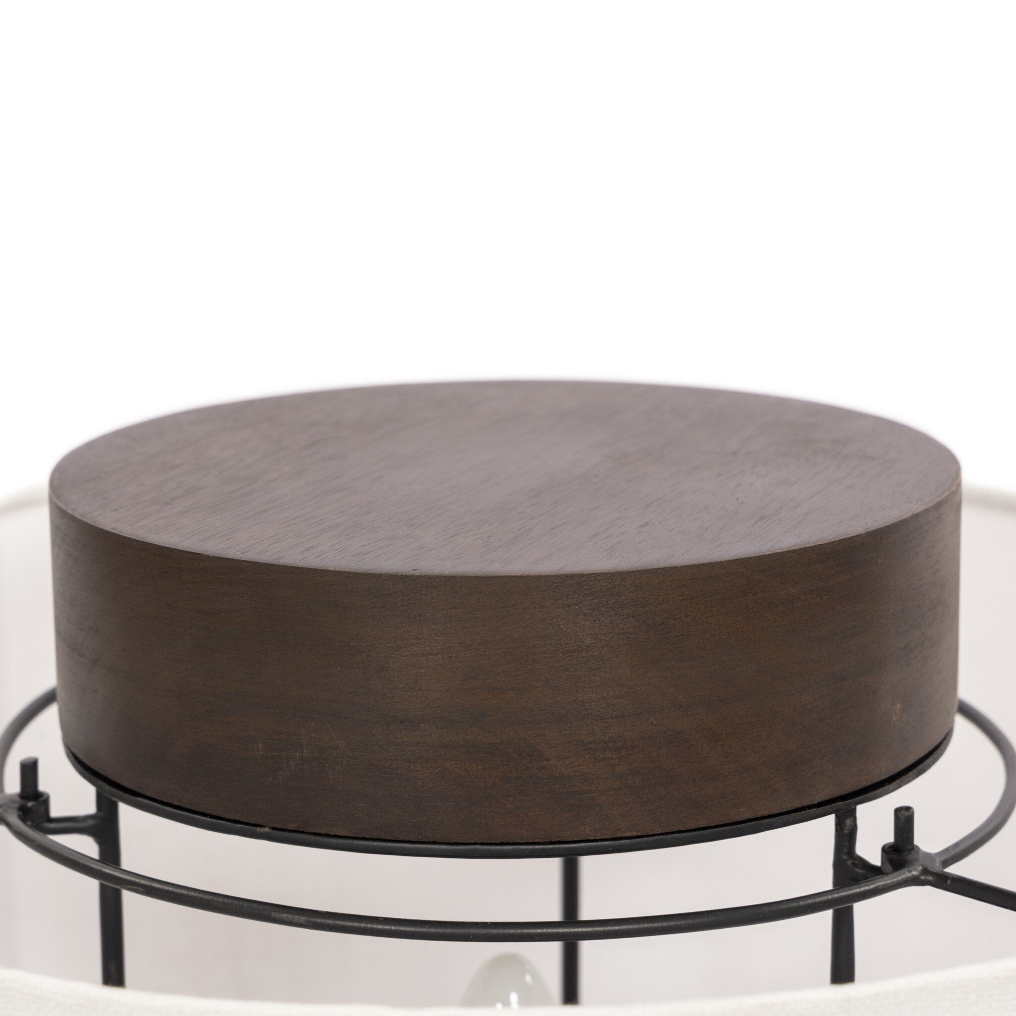 Round wooden lamp with metal lampshade support on a white background