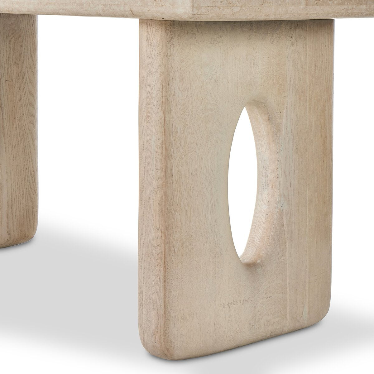 Close-up of a wooden bench leg with a hole, on a plain background.