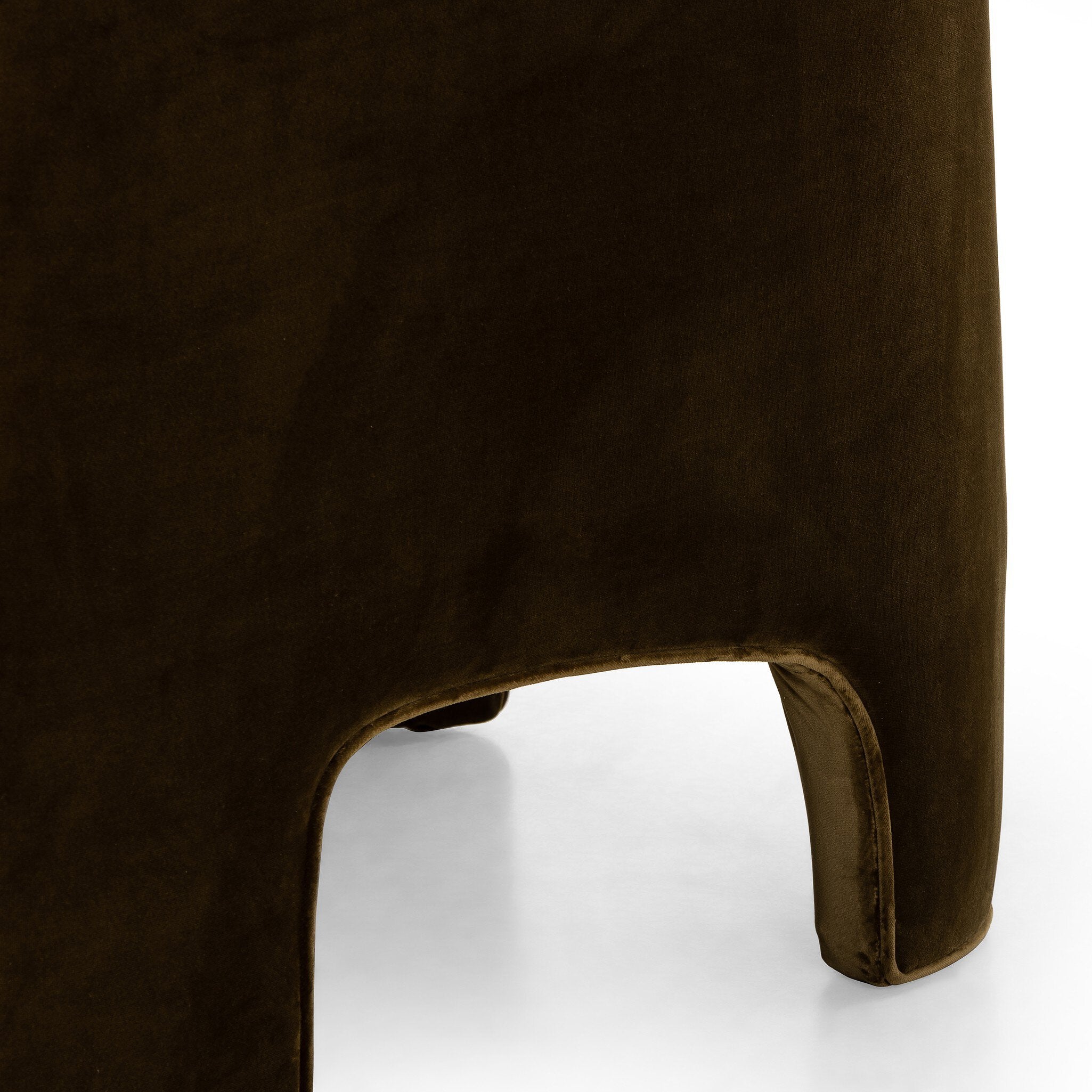 Brown velvet ottoman on a white background