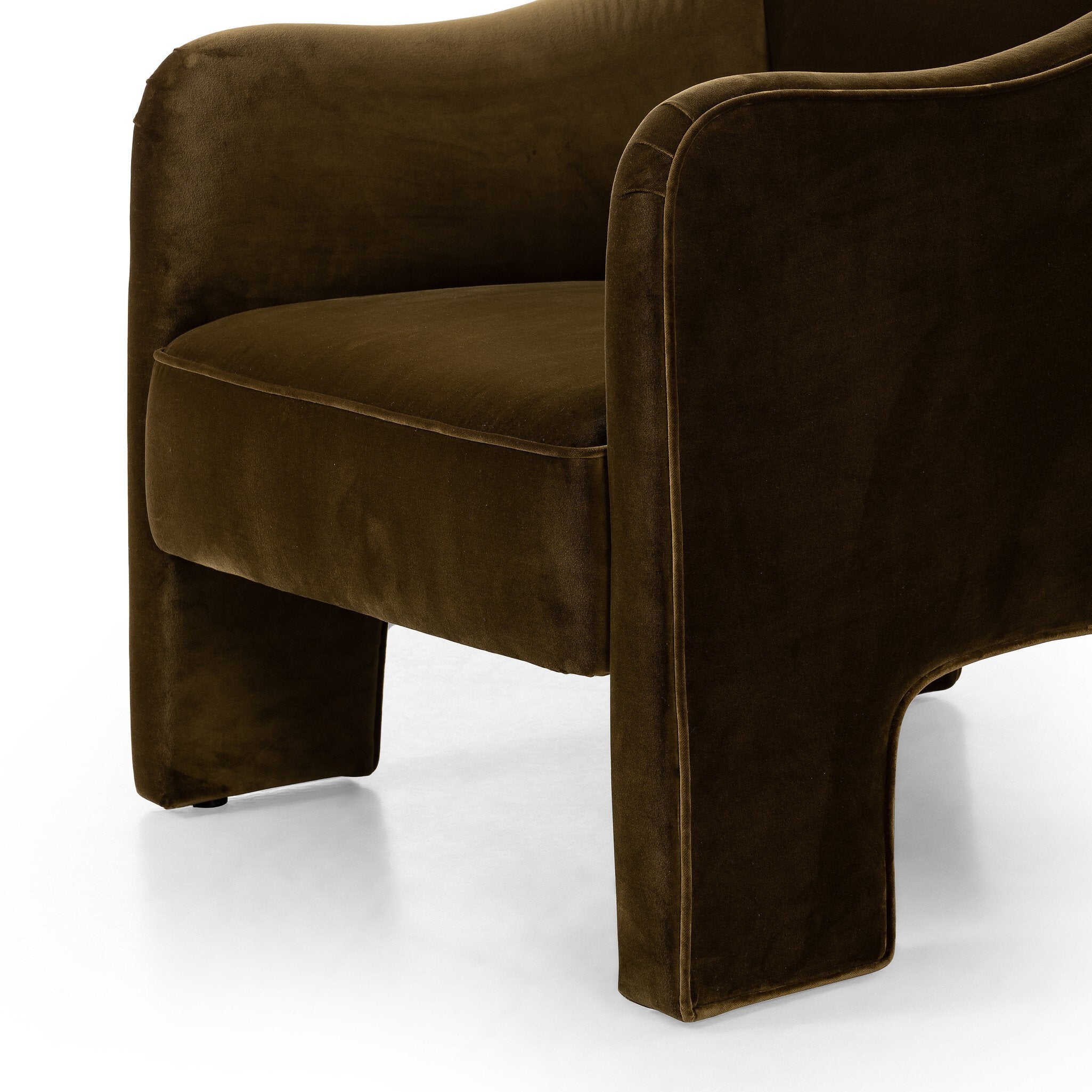 Brown velvet armchair on a white background