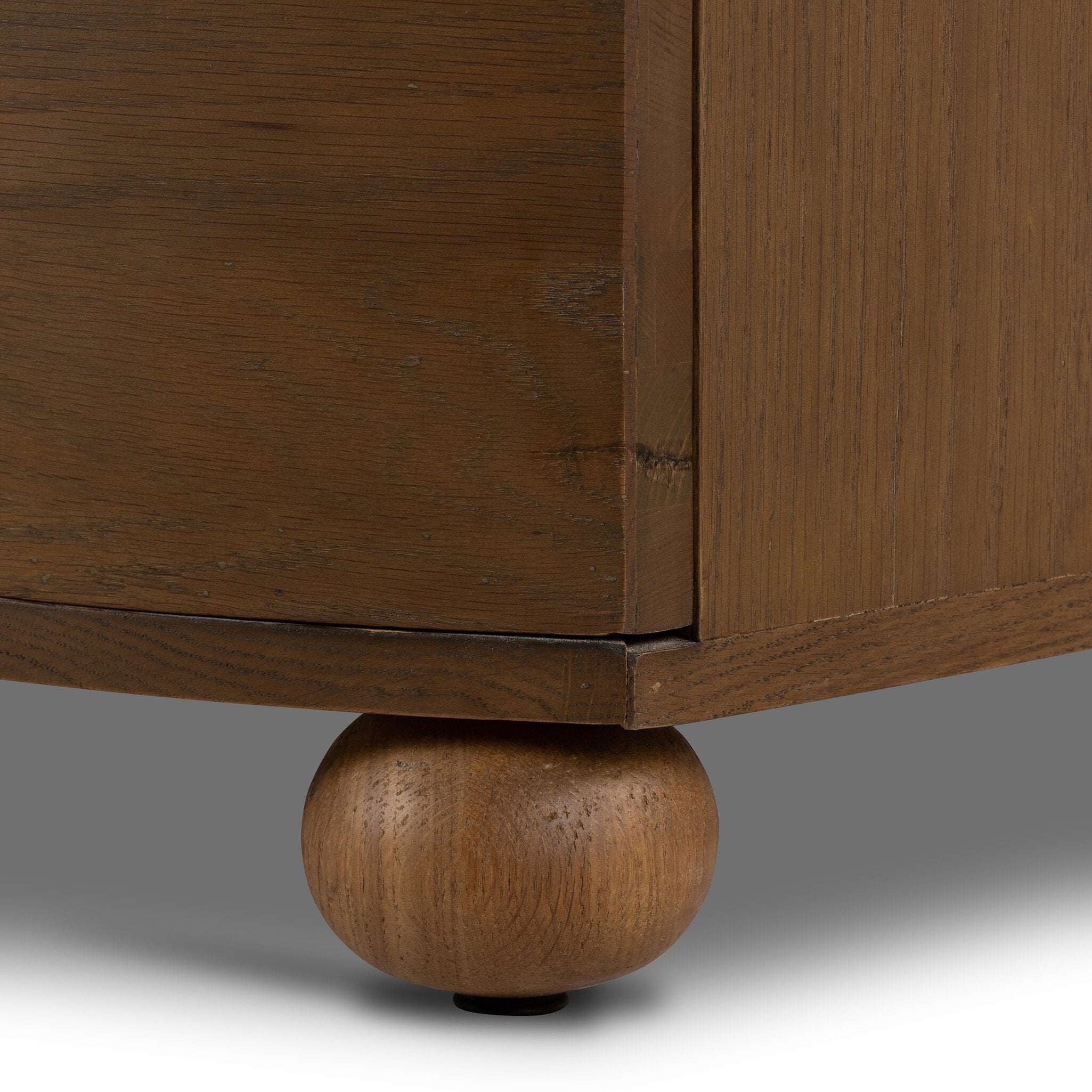 Close-up of a wooden cabinet leg