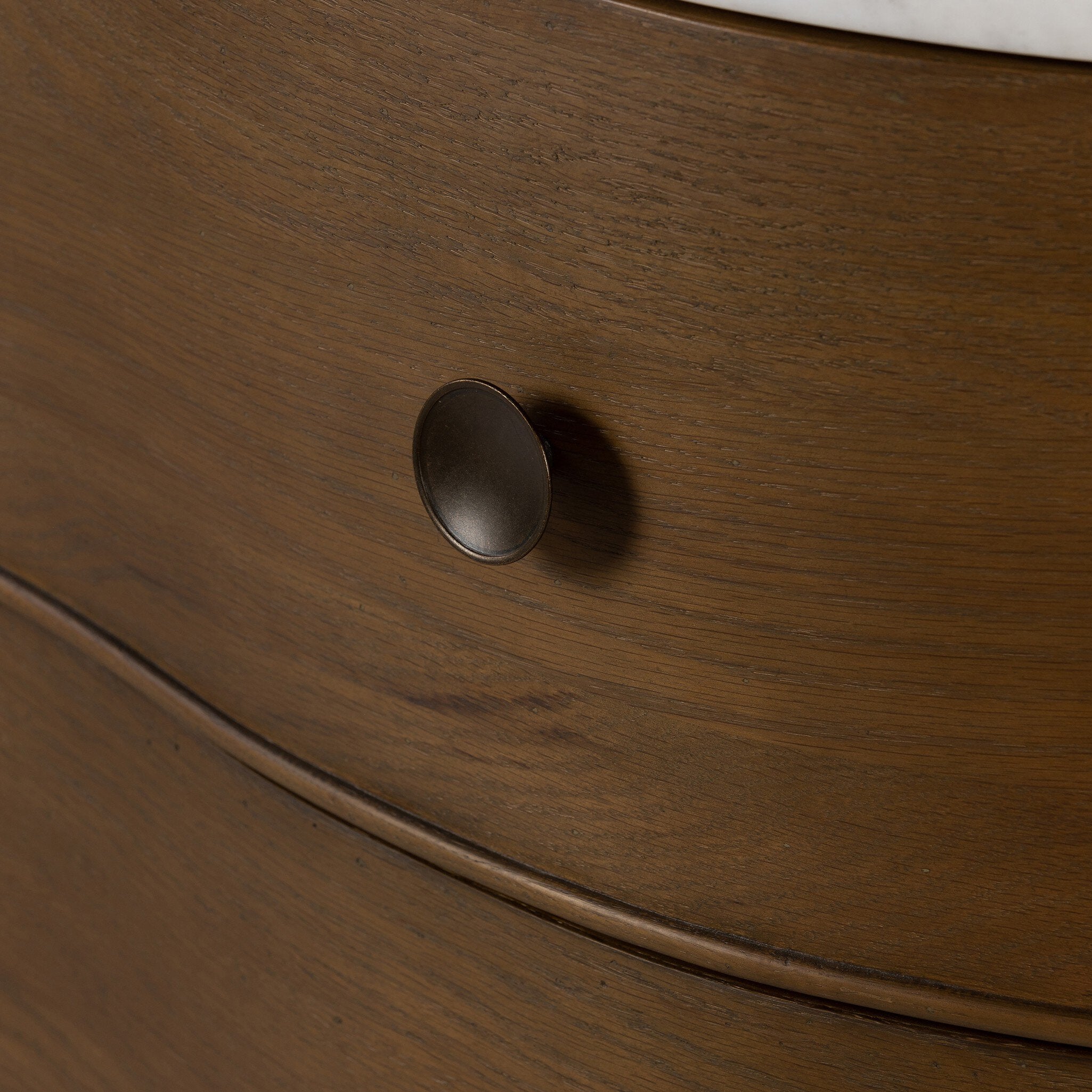 Close-up of a wooden drawer with a knob