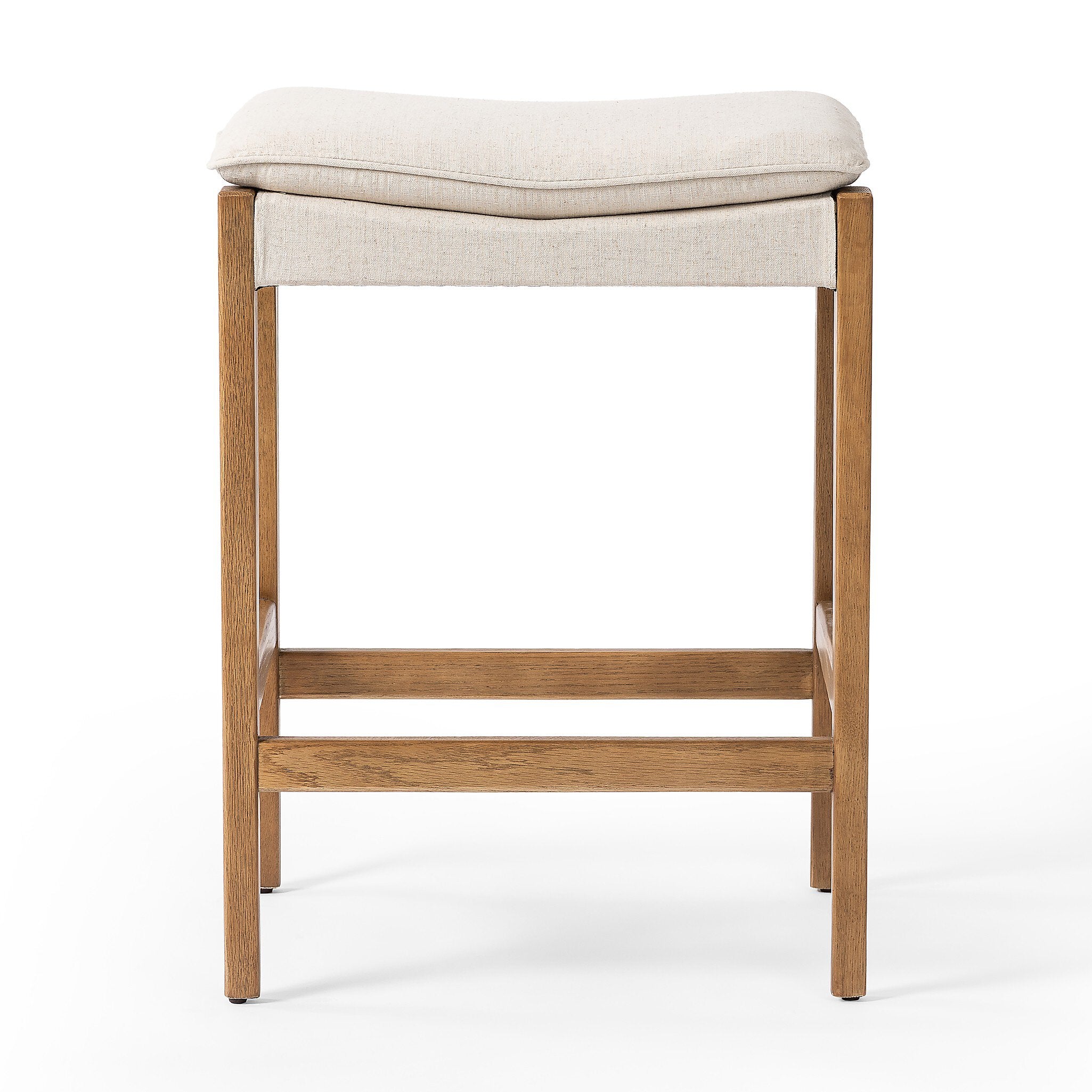 Wooden bar stool with a beige cushioned seat on a white background