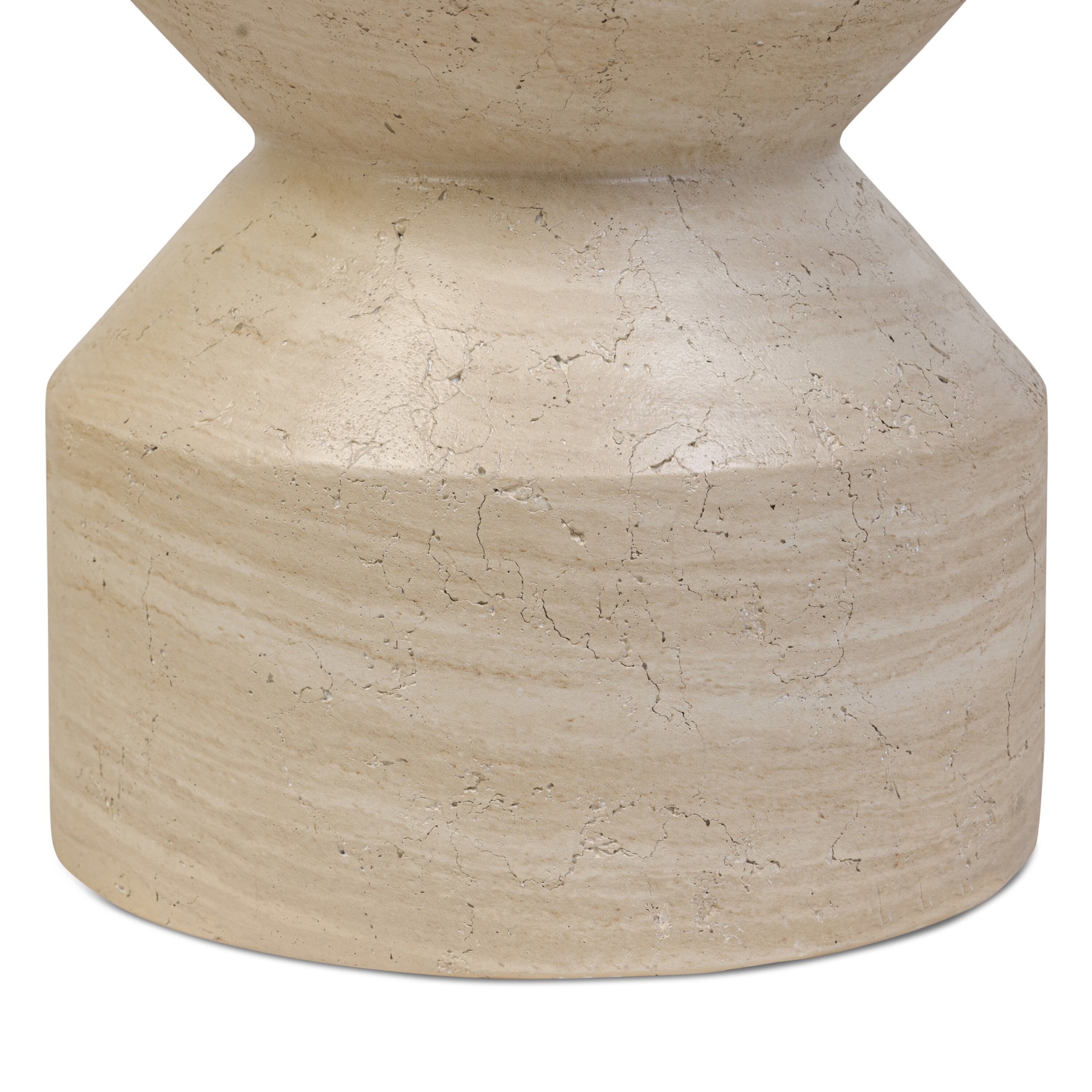 A beige concrete end table with a curved organic form and a textural sand finish.