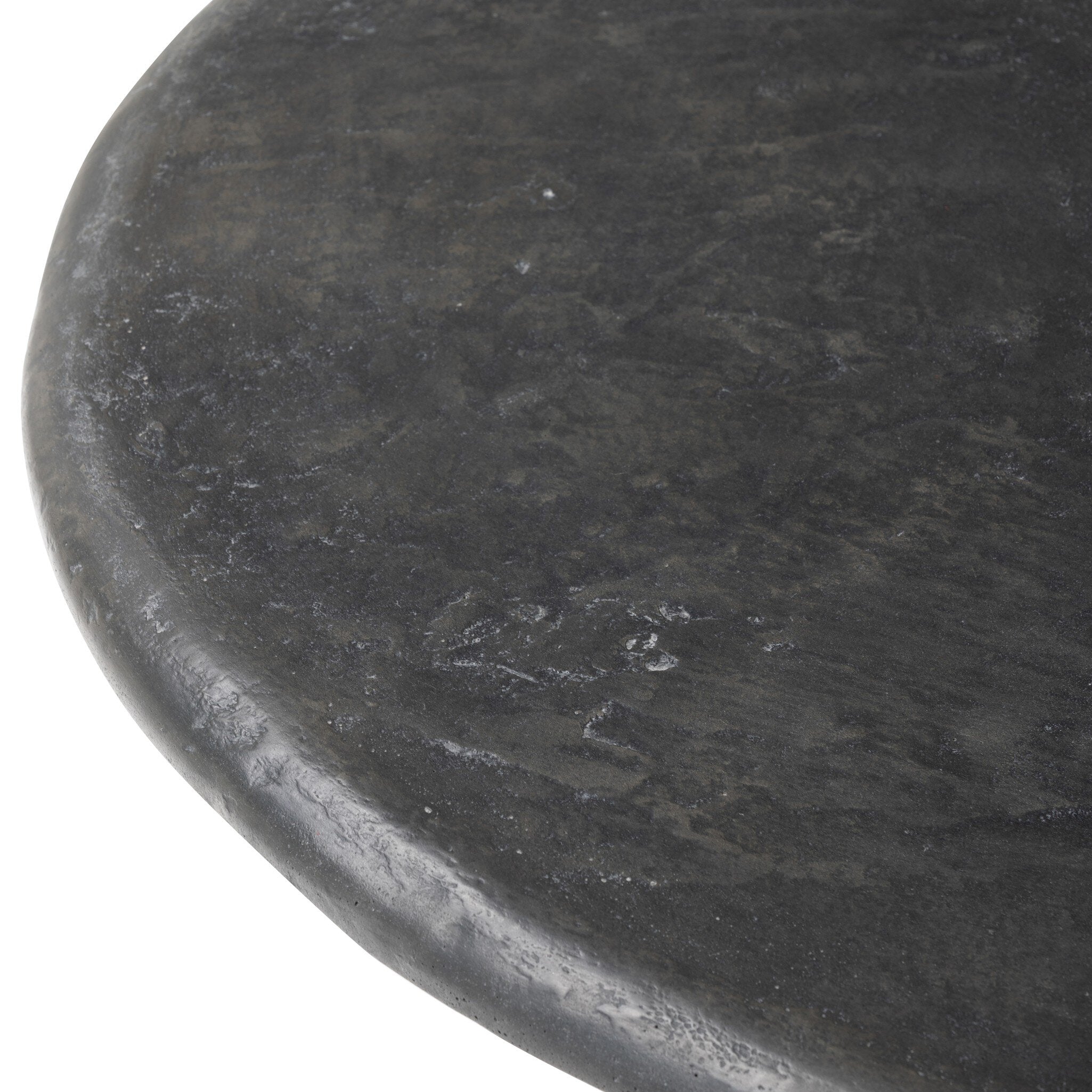 Close-up of a dark concrete round tabletop